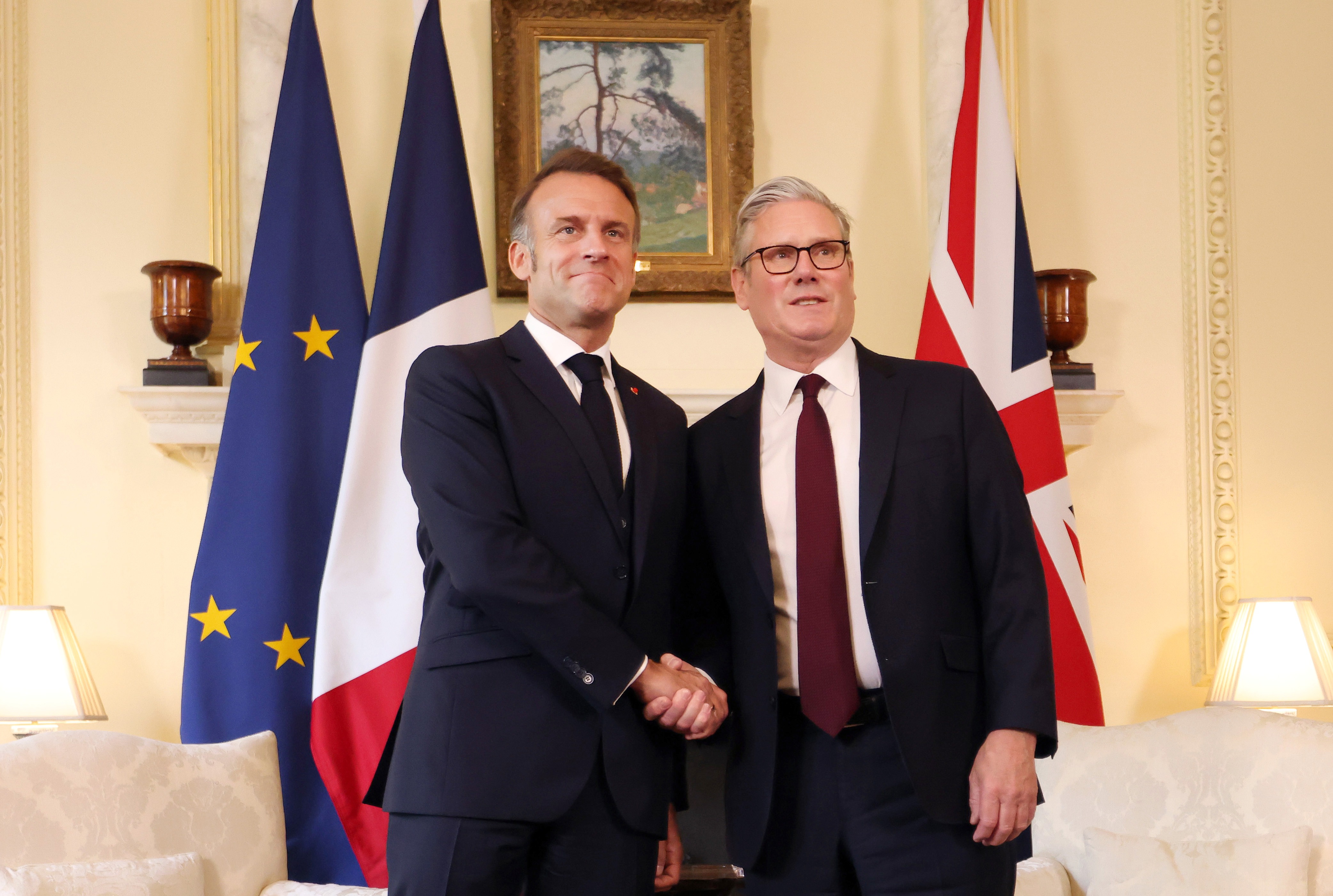 British Prime Minister Keir Starmer (R) and French President Emmanuel Macron (L) shake hands at 10 Downing Street in London, United Kingdom on July 9, 2025.