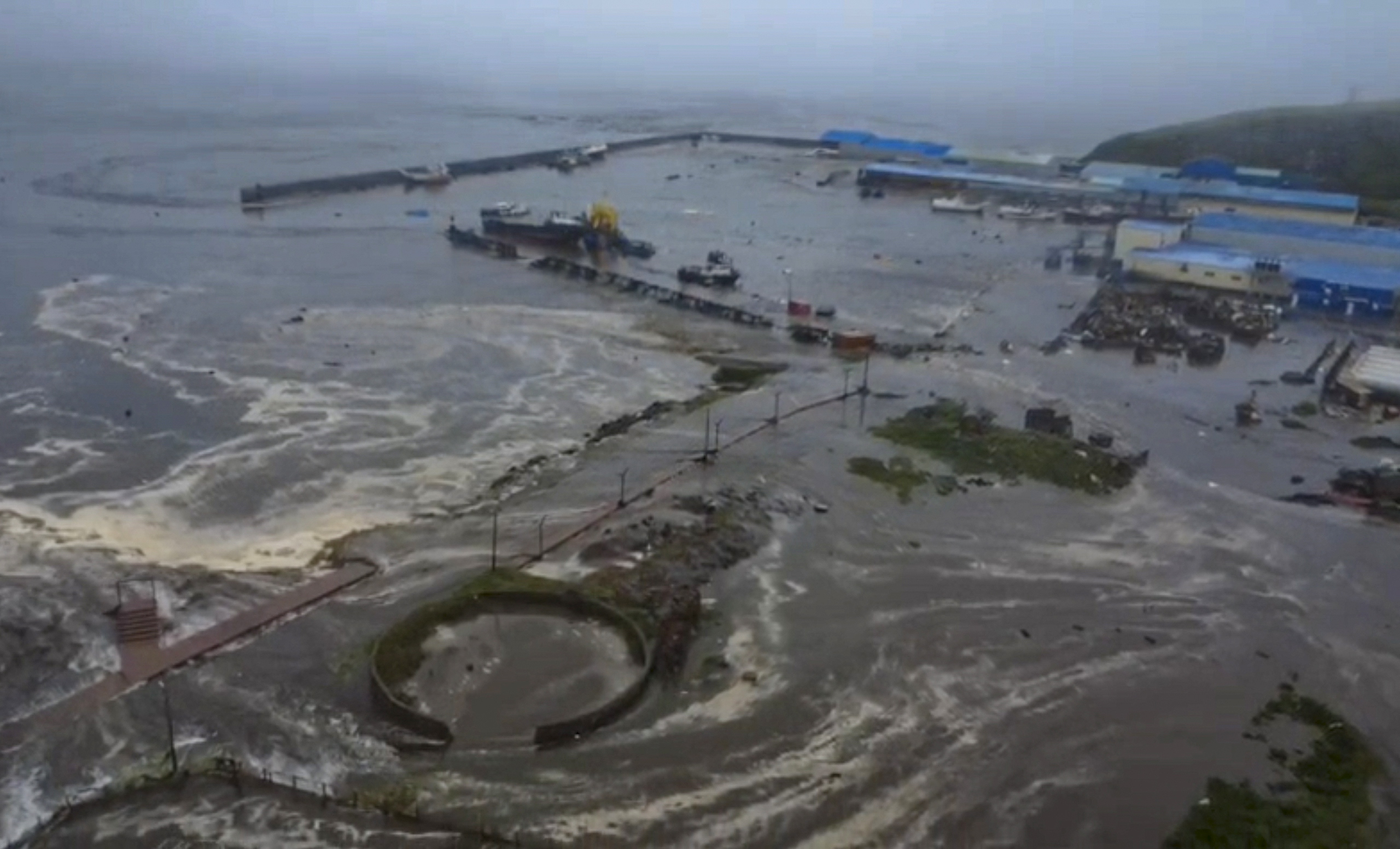 A still image taken from handout video provided by the Geophysical Center of the Russian Academy of Sciences shows a flooded area in Severo-Kurilsk, Sakhalin Region, Russia