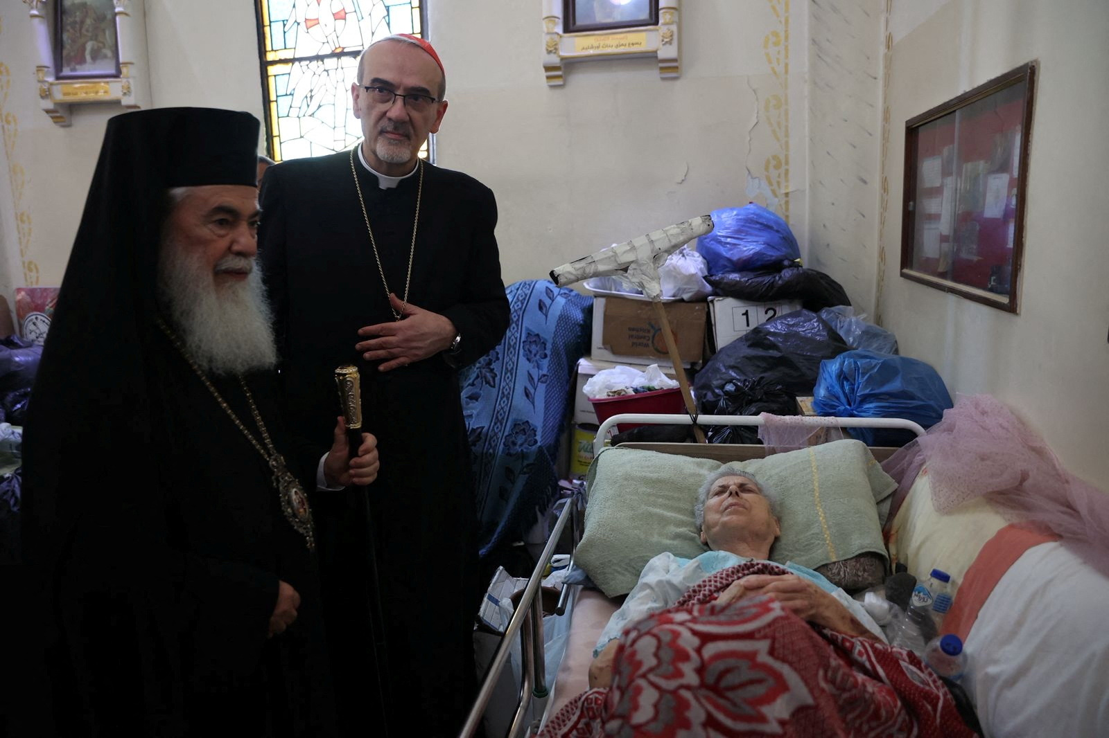Latin Patriarch of Jerusalem Archbishop Pierbattista Pizzaballa and Greek Orthodox Patriarch of Jerusalem, Theophilos III visit the Church of the Holy Family which was hit in an Israeli strike on Thursday, in Gaza City July 18, 2025. The Latin patriarchate of Jerusalem/Handout via REUTERS THIS IMAGE HAS BEEN SUPPLIED BY A THIRD PARTY