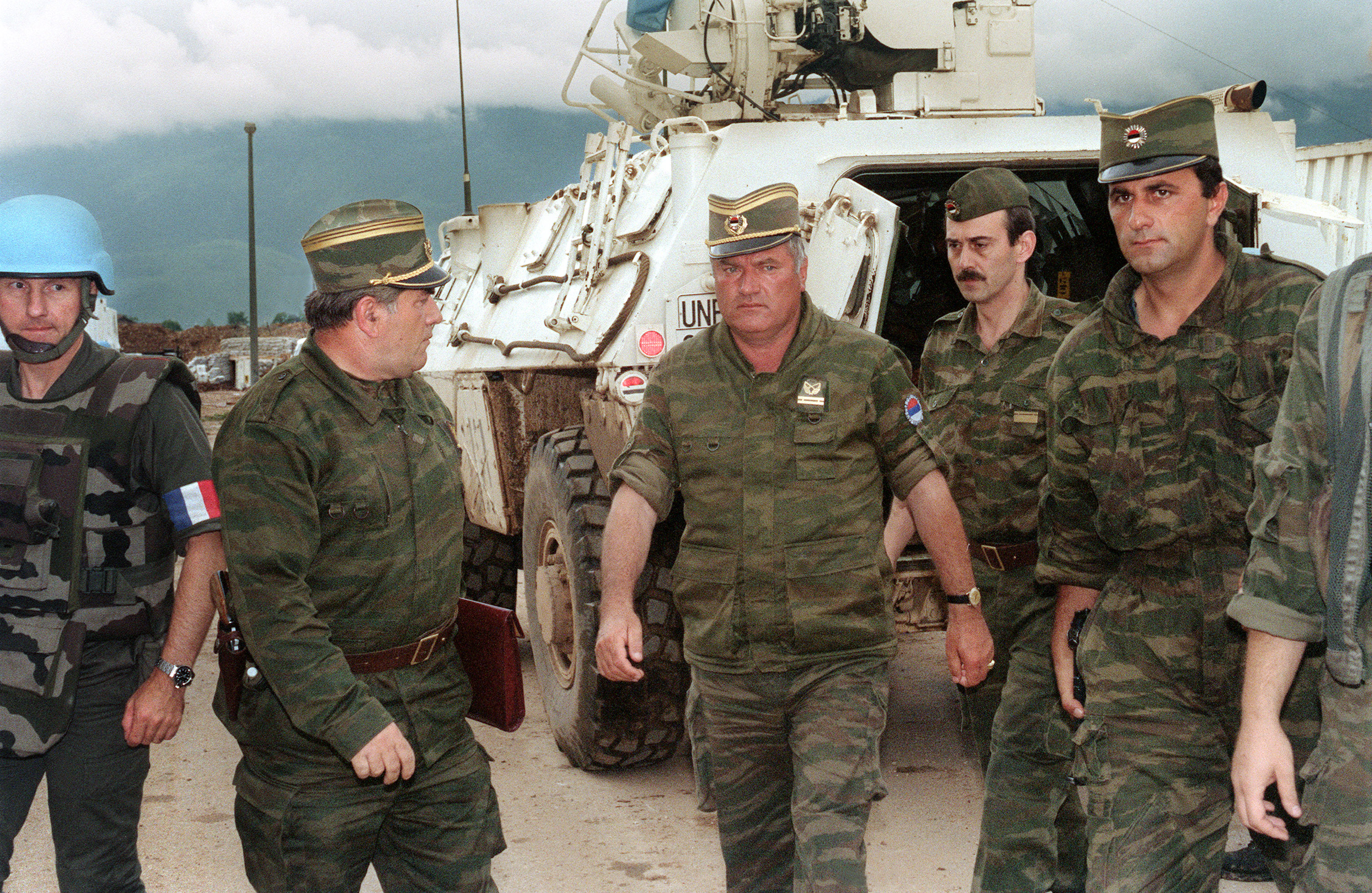 Ratko Mladic, centre, with soldiers at the airport in Sarajevo on August 10, 1993, during the Bosnia War