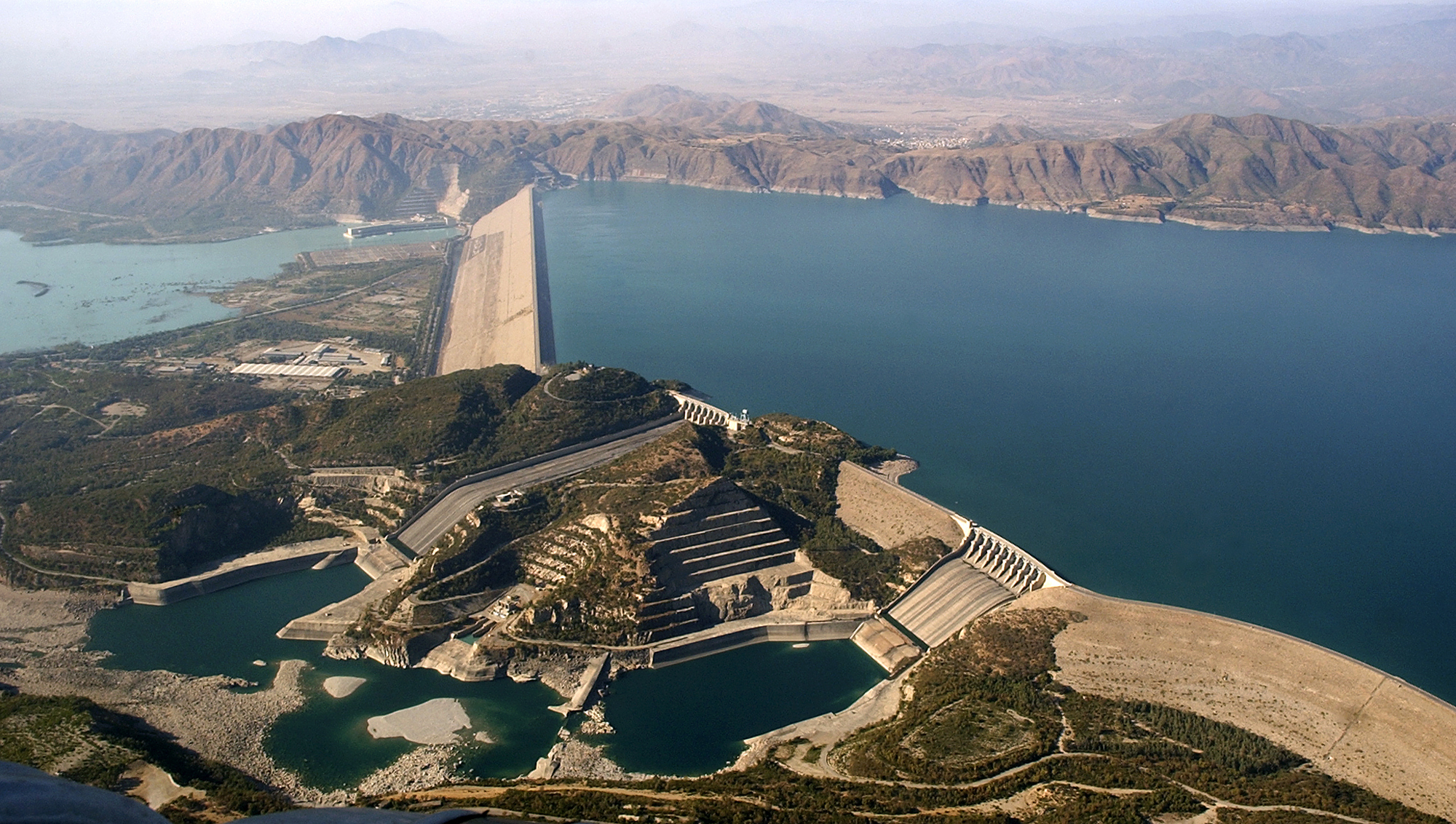 In this photo taken on Nov. 18, 2005, Pakistan's biggest Tarbela Dam is observed from a helicopter in Tarbela, Pakistan. Cash-strapped Pakistan should pursue clean energy instead of relying on coal, nuclear and hydroelectric power, according to a report released Wednesday urging the country's policymakers to rethink plans for building more coal-fired plants. (AP Photo/Anjum Naveed, File)