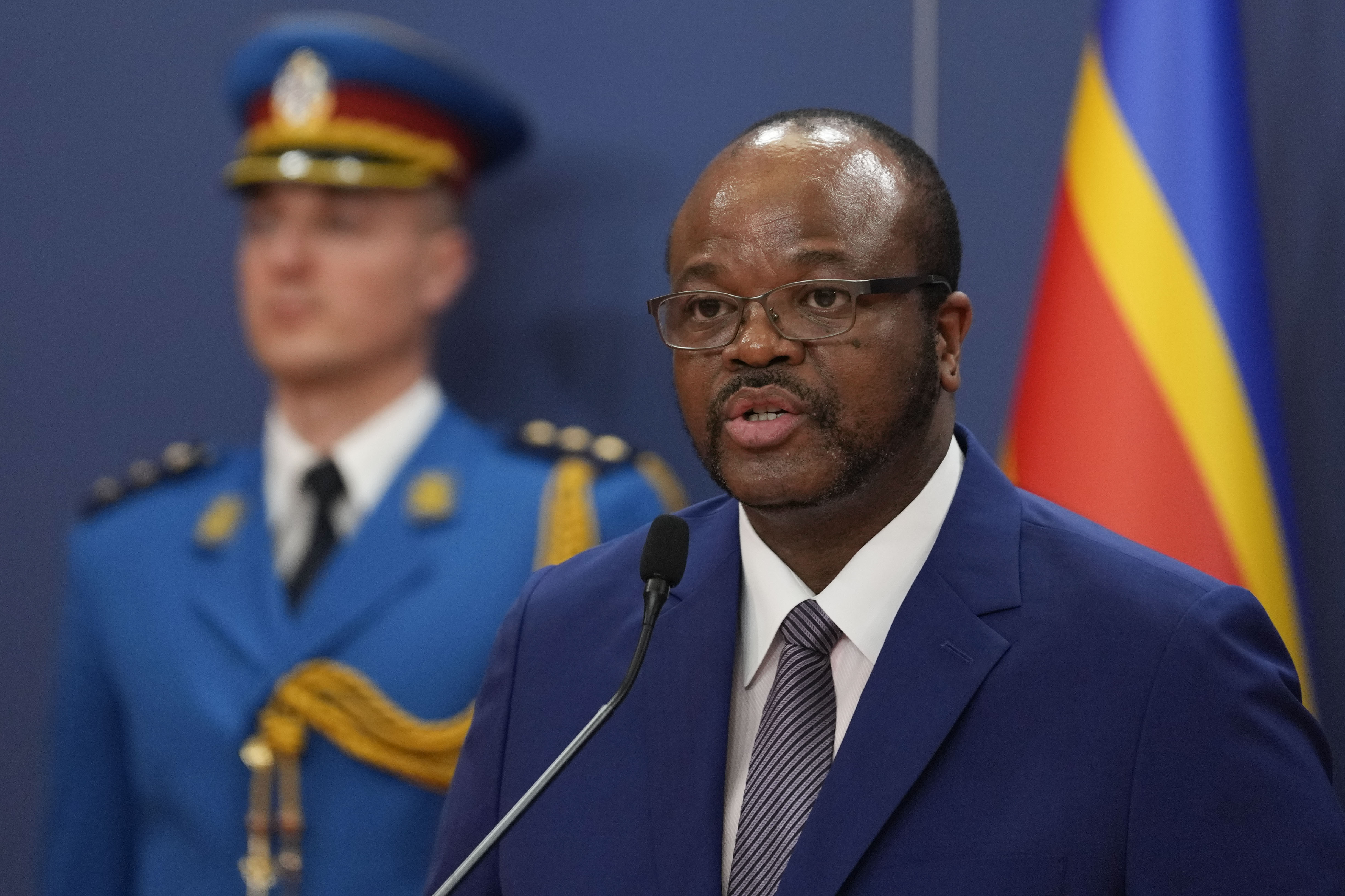 Eswatini's King Mswati III speaks into a microphone at Serbia Palace.
