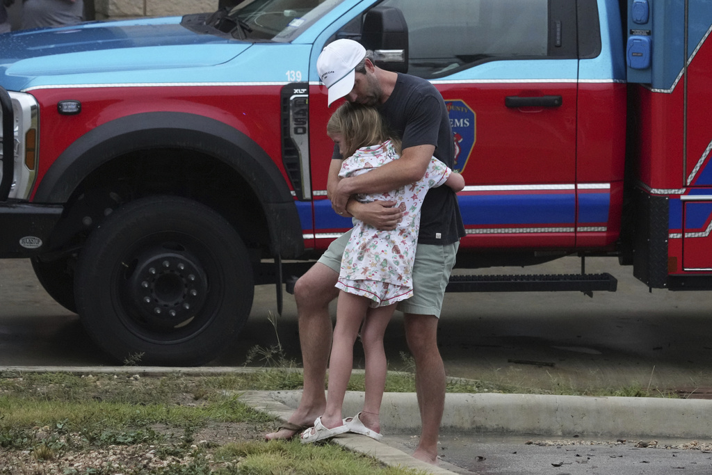 Reunited family members after Texas flash flooding