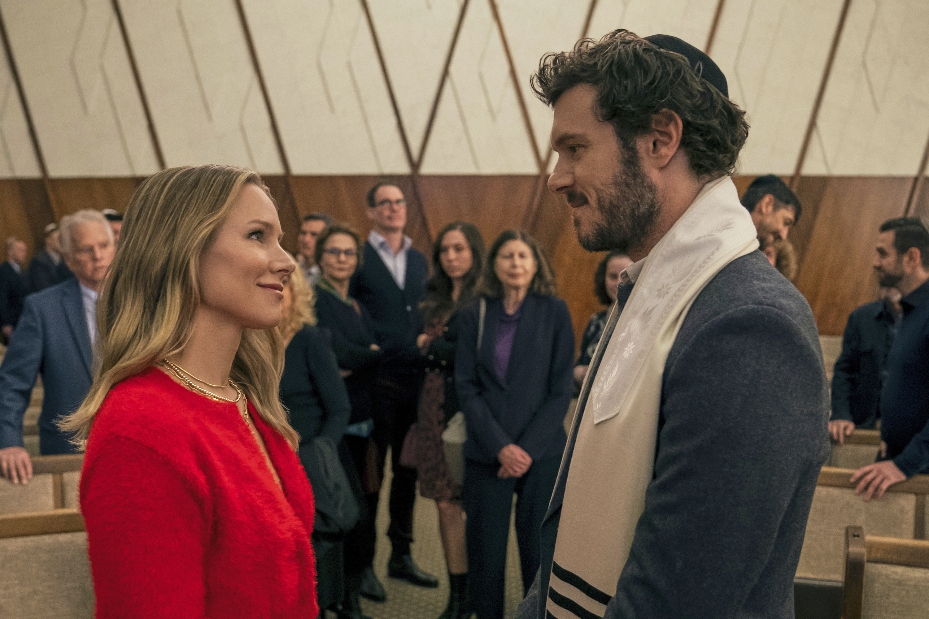 This image released by Netflix shows Kristen Bell, left, and Adam Brody in a scene from "Nobody Wants This."