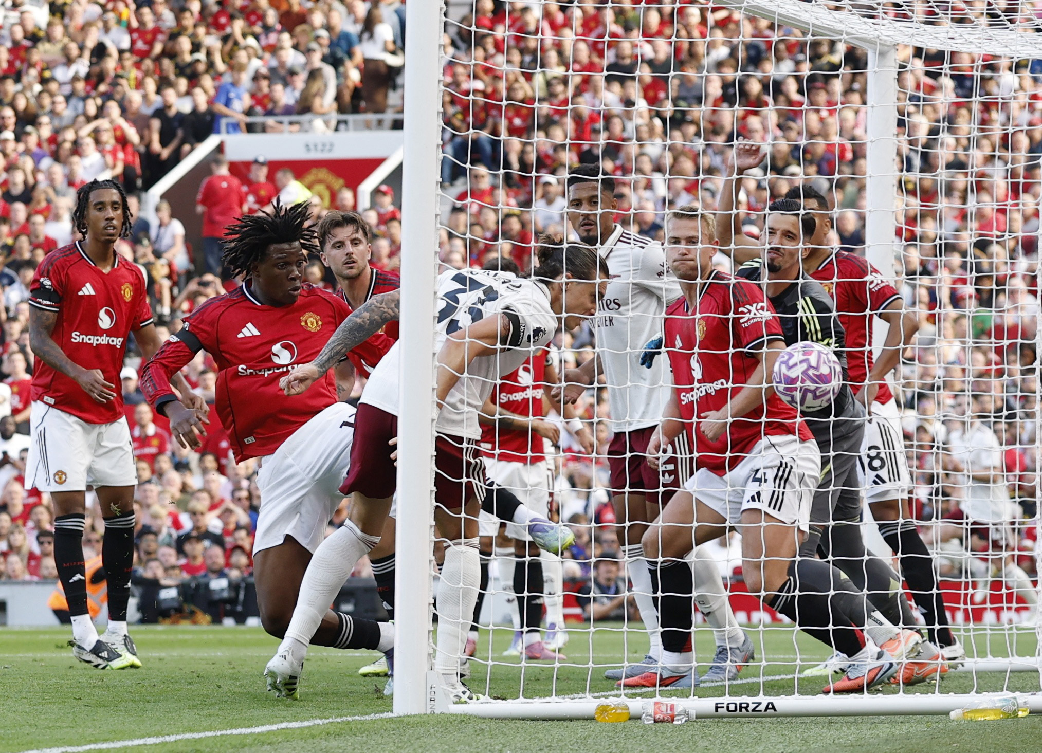 Arsenal's Riccardo Calafiori scores their first goal