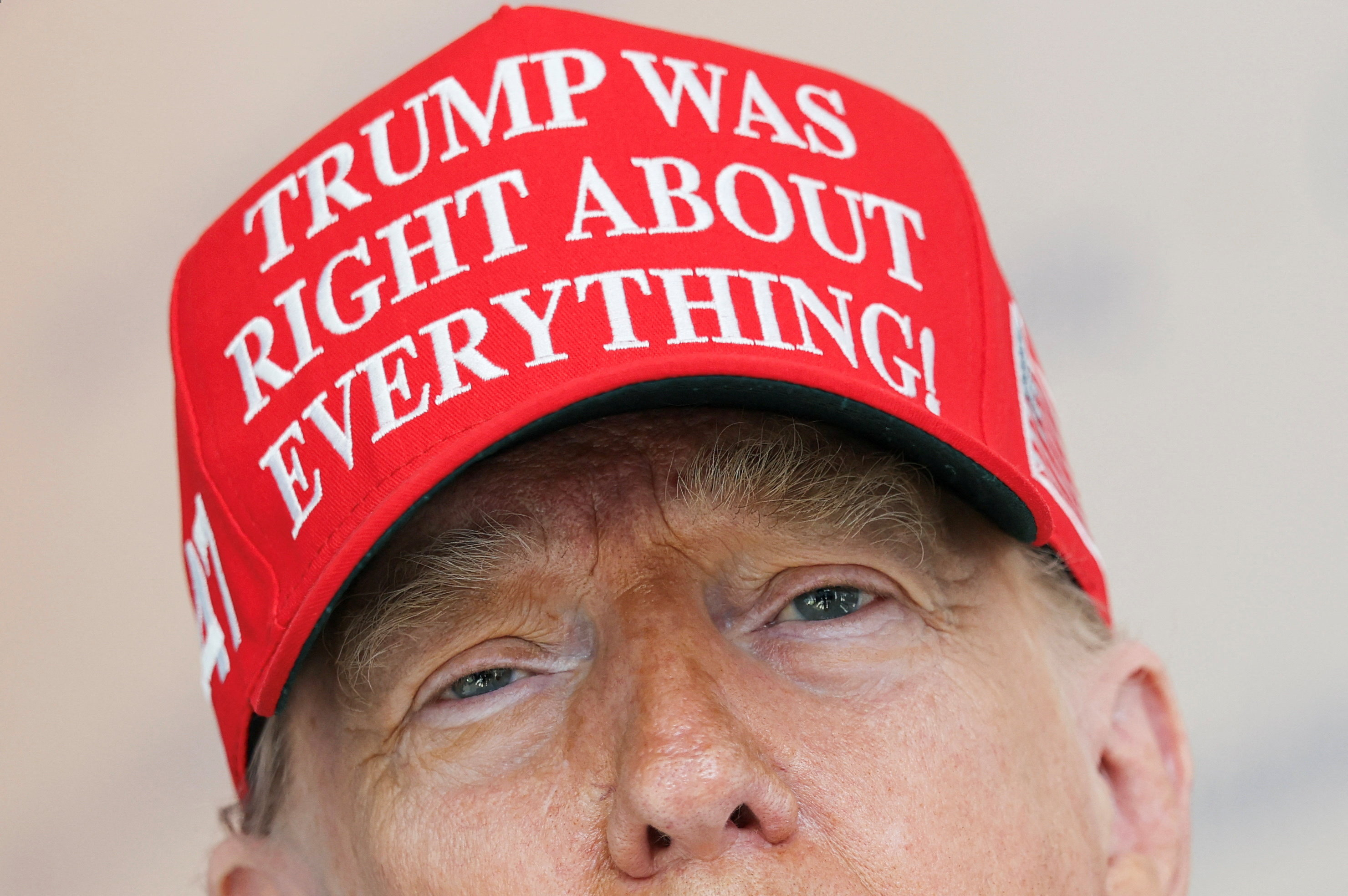 US President Donald Trump wears a 'Trump Was Right About Everything!' hat.
