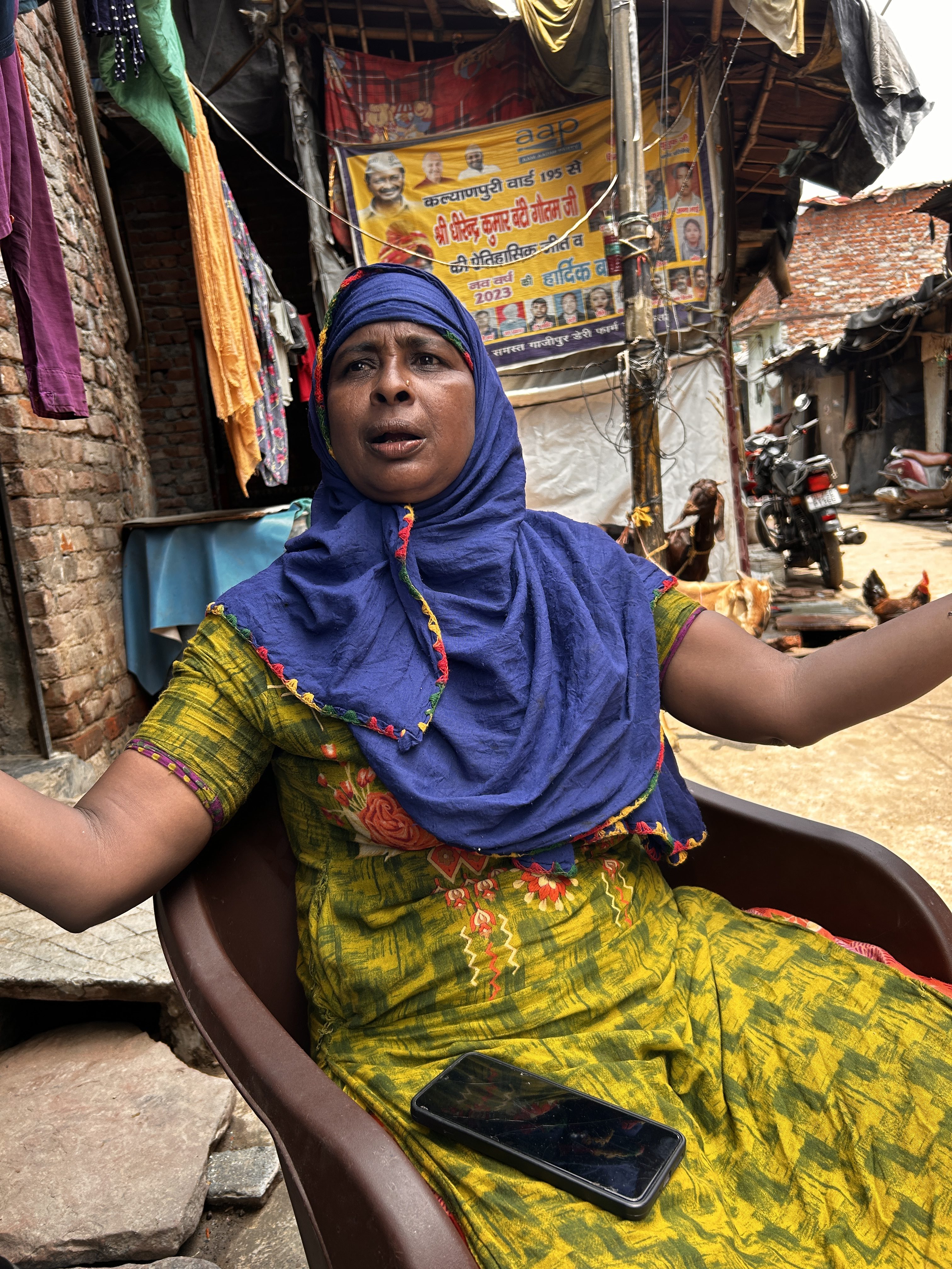 Sofia Begum, 38, in the slum settlement she lives in beside the Ghazipur landfill site in New Delhi. Her eye was infected by medical waste last year and it swells painfully in sunlight