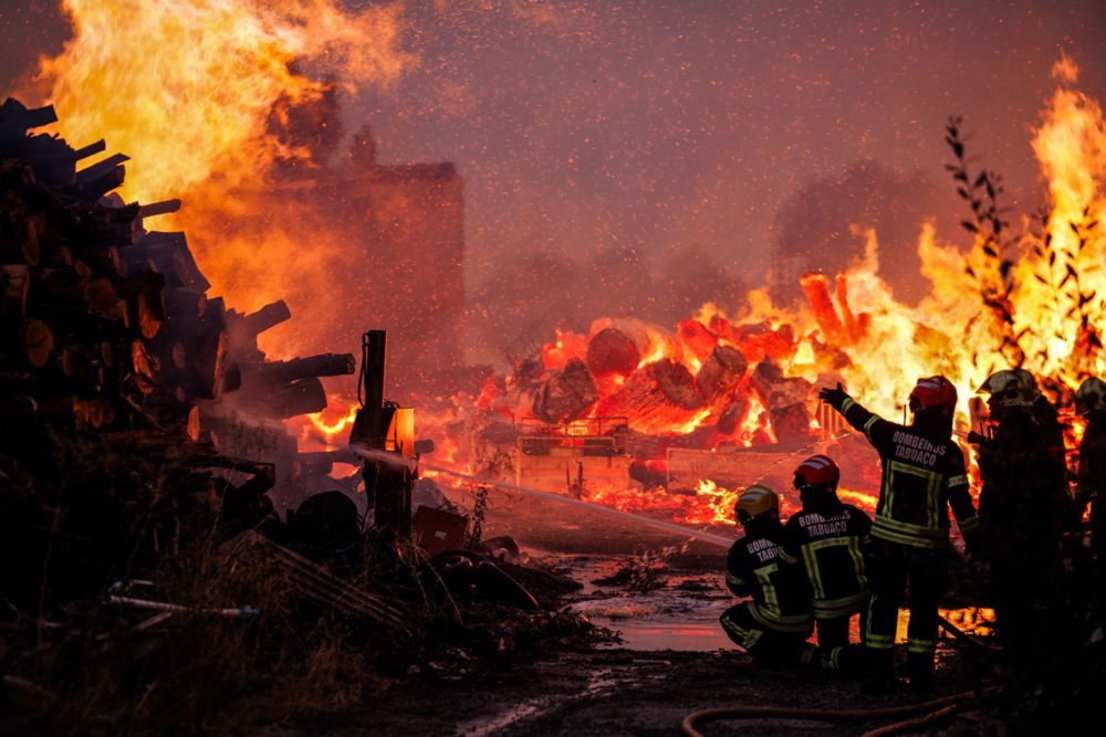 Firefighters battle a forest fire.