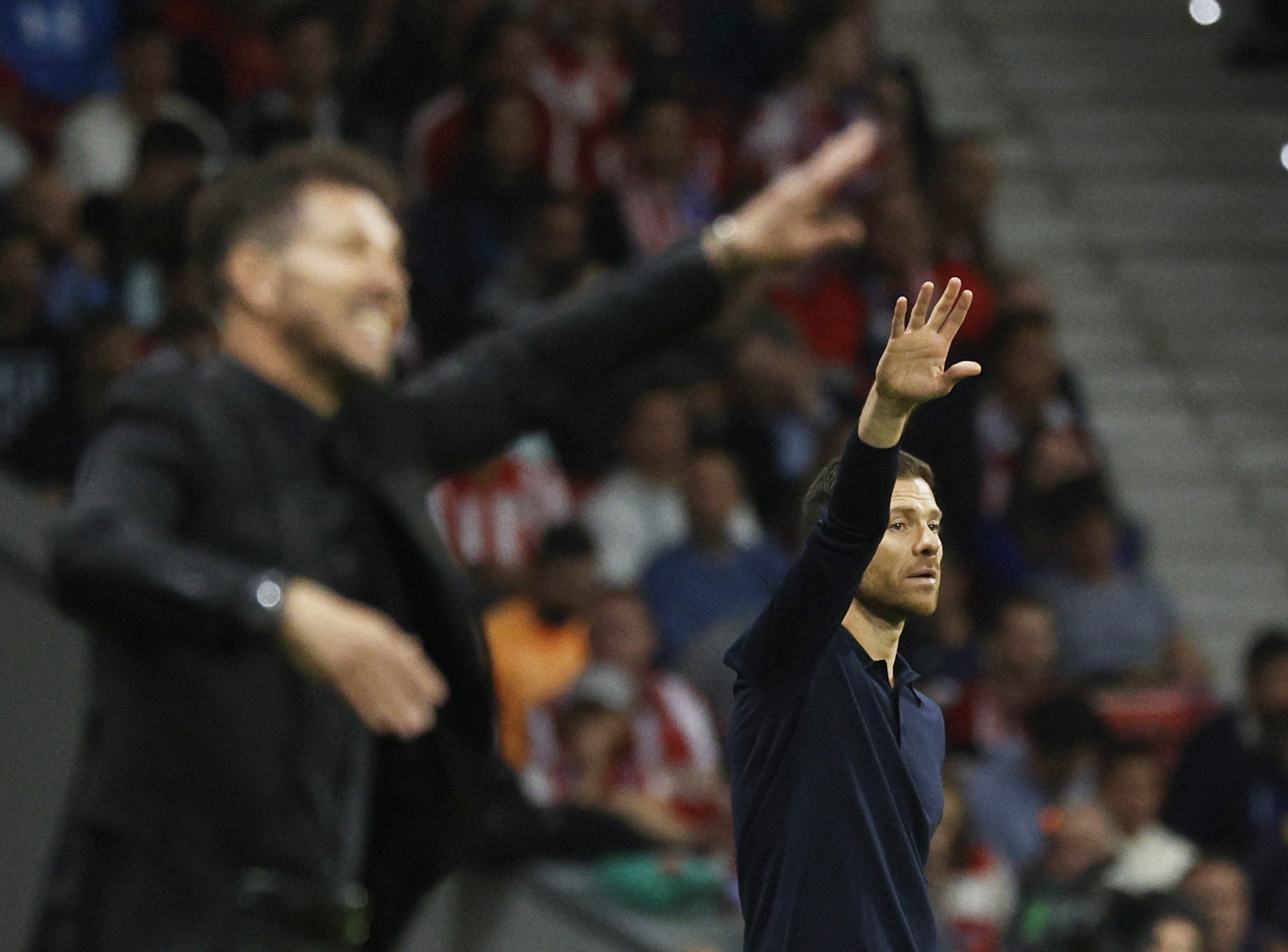 Bayer Leverkusen coach Xabi Alonso and Atletico Madrid coach Diego Simeone