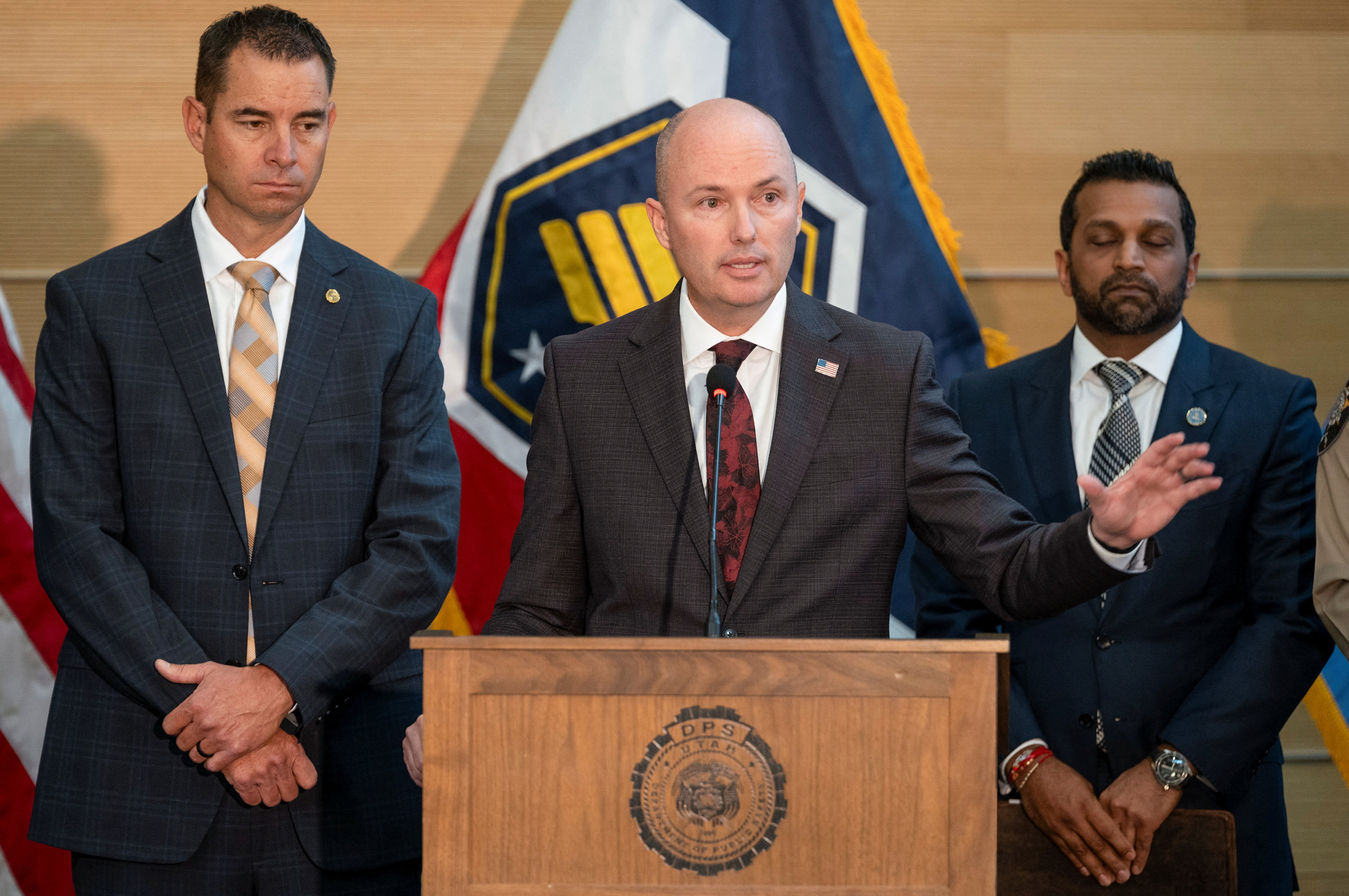 Utah Governor Spencer Cox, with Utah Department of Public Safety Beau Mason and FBI Director Kash Patel, gestures as he speaks during a press conference announcing details on the suspect in the shooting of U.S. conservative commentator Charlie Kirk, who was fatally shot during an event at Utah Valley University, in Orem, Utah, U.S. September 12, 2025. REUTERS/Cheney Orr