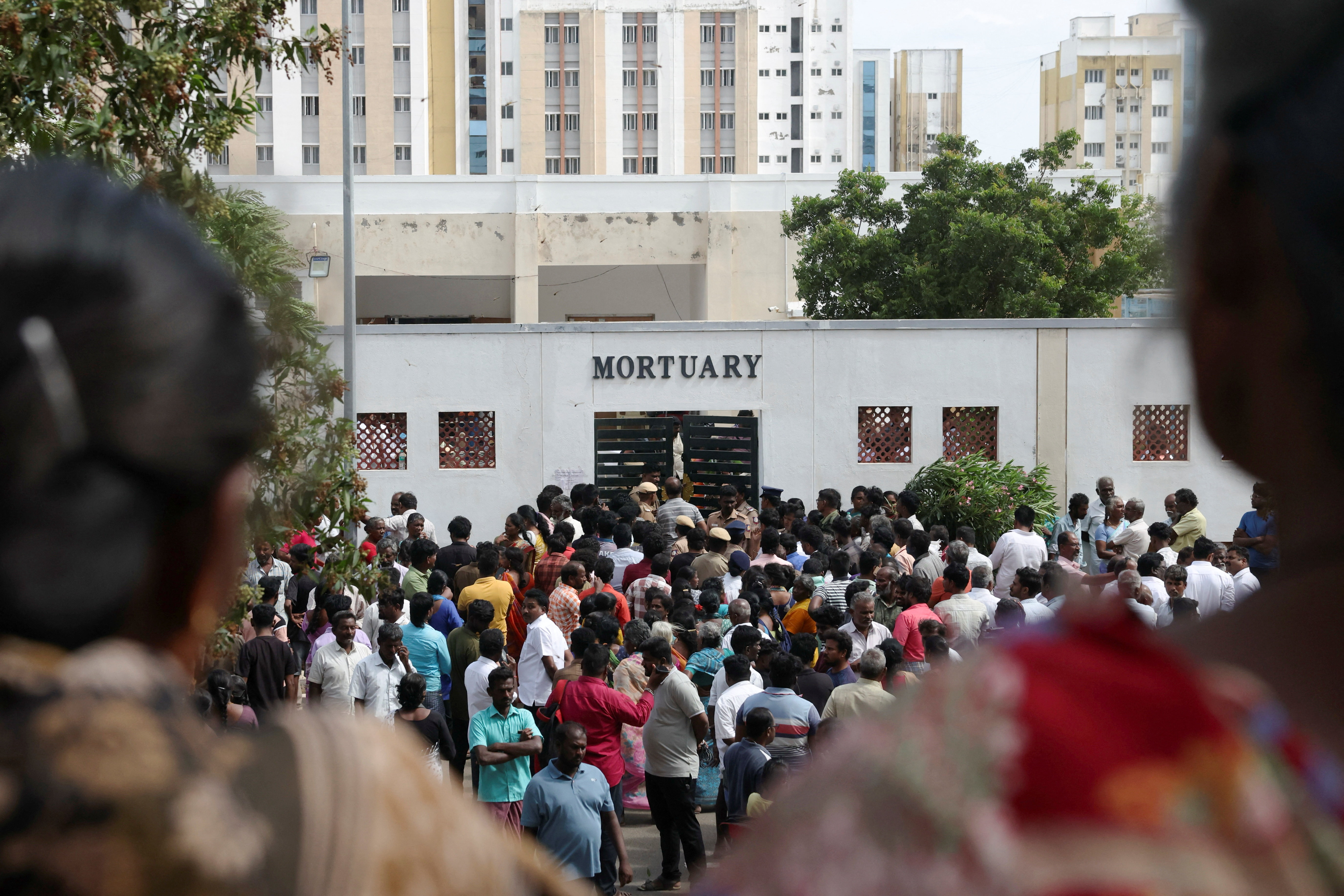 Relatives gather in front of the mortuary of Karur Government Medical College to receive bodies of victims following a stampede incident at an election campaign rally held by Tamilaga Vettri Kazhagam, in Karur district of Tamil Nadu, India, September 28, 2025. REUTERS/Priyanshu Singh