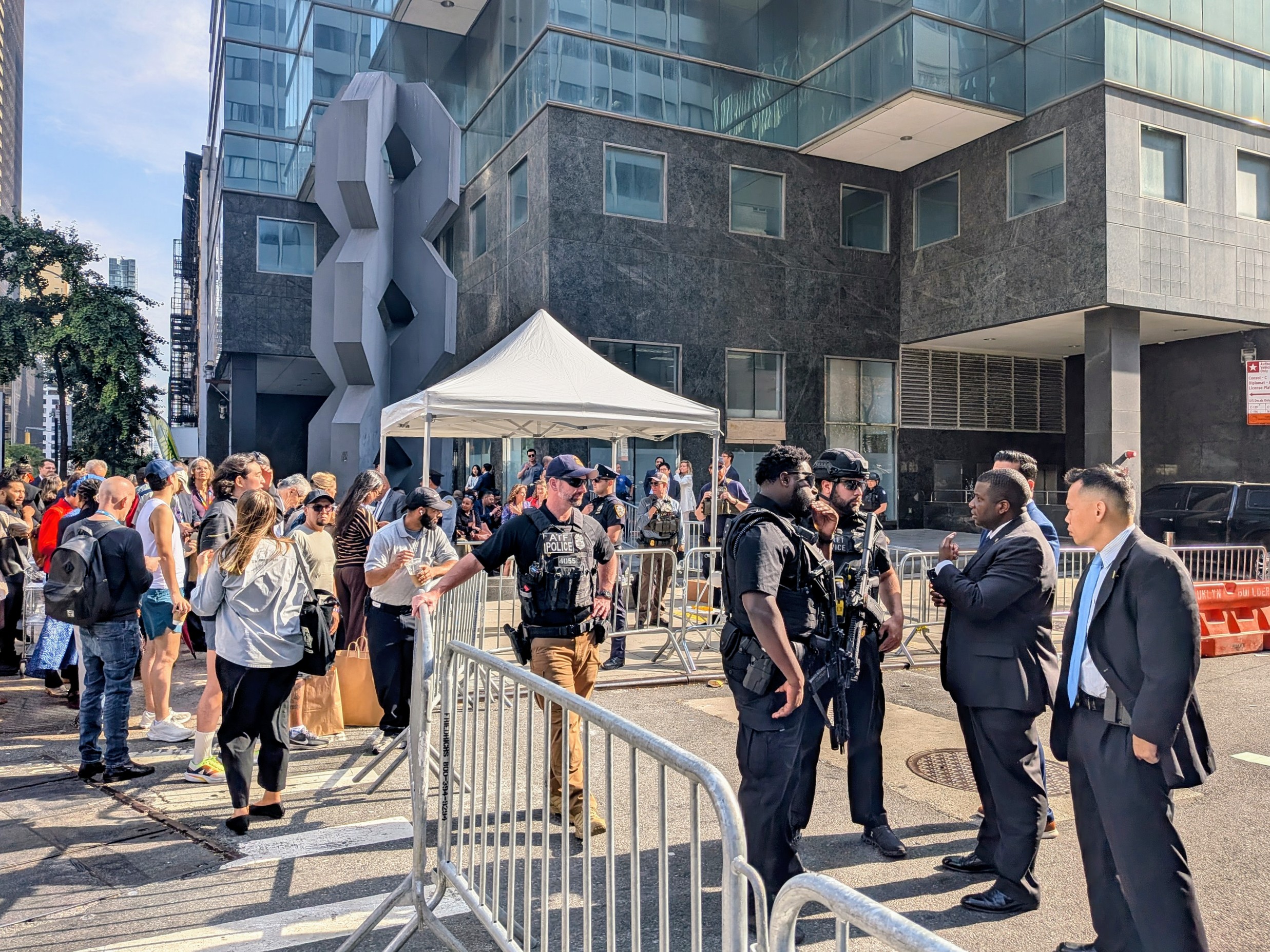 Road crossing with officers and peop;le