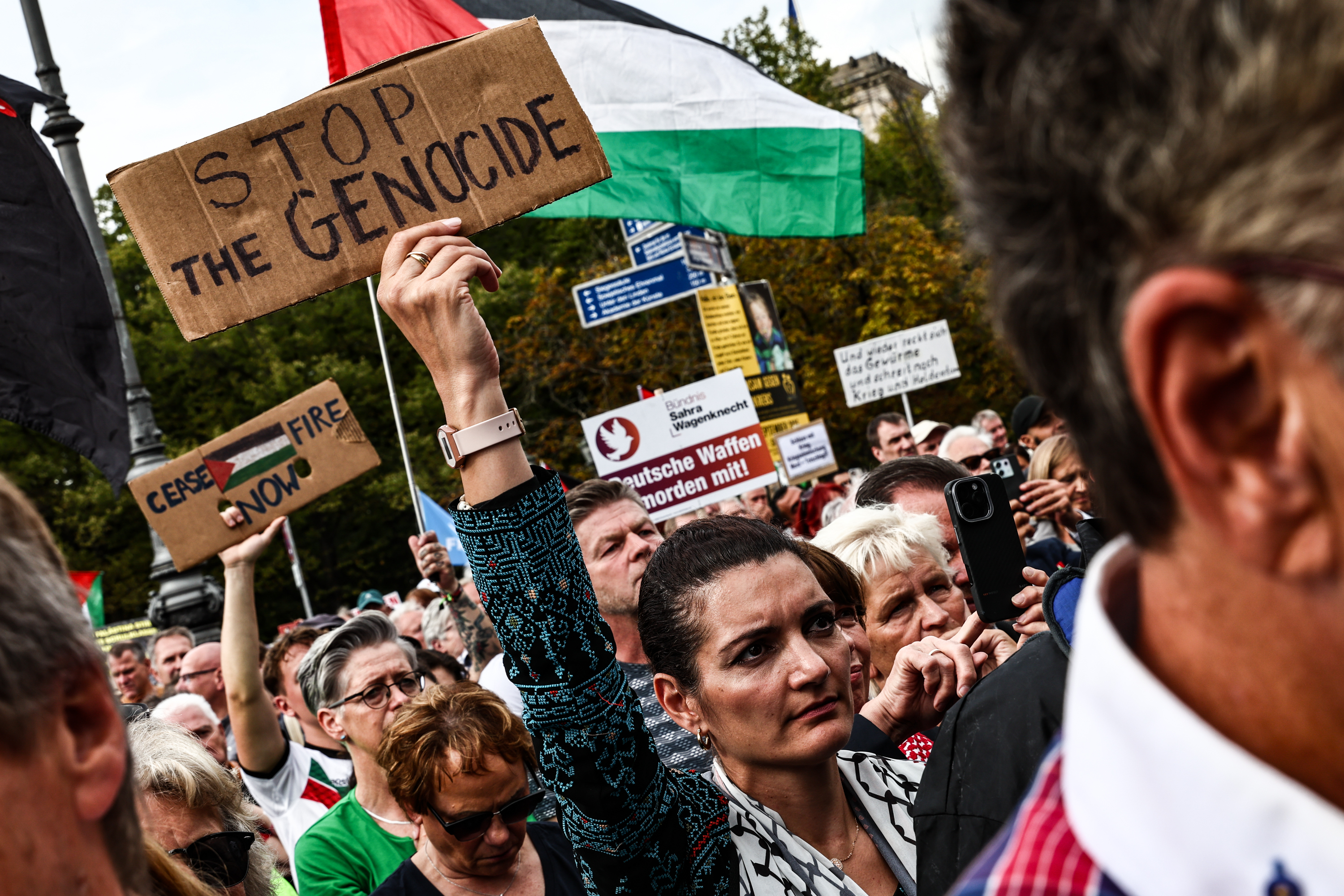 epa12373609 A person holds a placard during a demonstration under the slogan 'No weapons in war zones! Peace instead of arms race! Stop the genocide in Gaza!' organized by the Sahra Wagenknecht Alliance (BSW) party in Berlin, Germany, 13 September 2025. EPA/FILIP SINGER