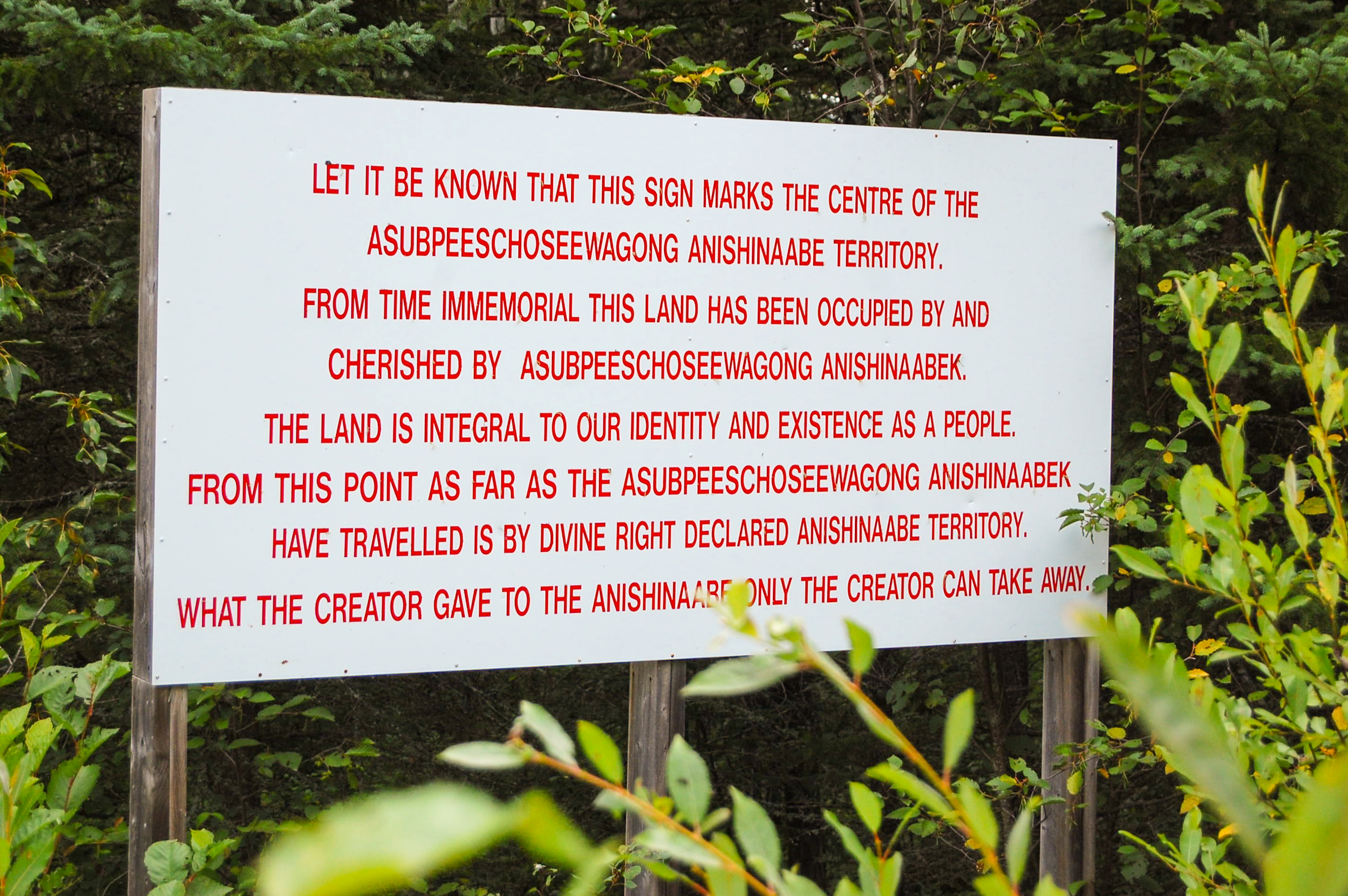 A land defence billboard is seen on a road leading to the Grassy Narrows blockade site