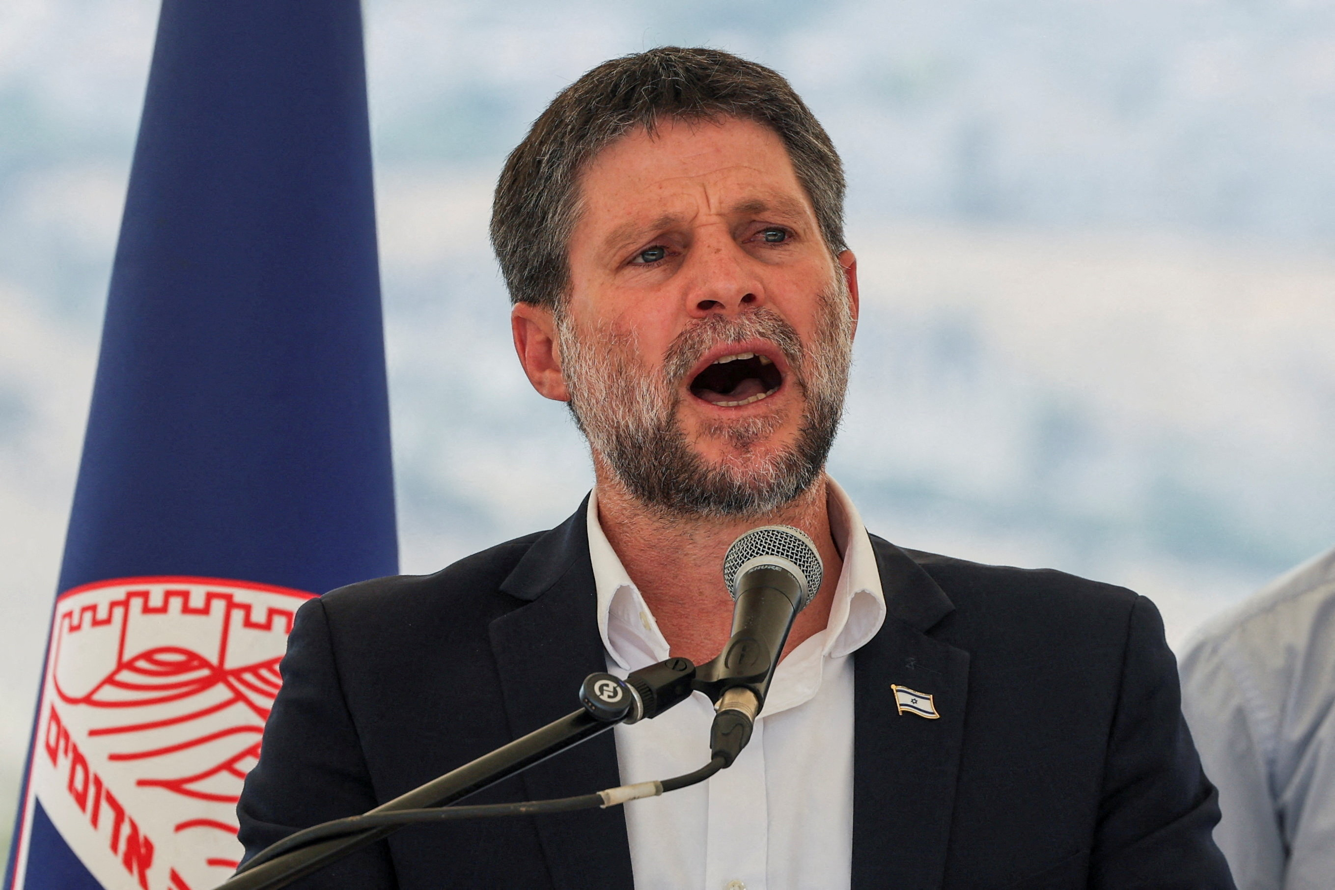 FILE PHOTO: Israeli Finance Minister Bezalel Smotrich speaks at a press conference regarding settlements expansion for the long-frozen E1 settlement, that would split East Jerusalem from the occupied West Bank, near the Israeli settlement of Maale Adumim in the Israeli-occupied West Bank, August 14, 2025. REUTERS/Ronen Zvulun/File Photo