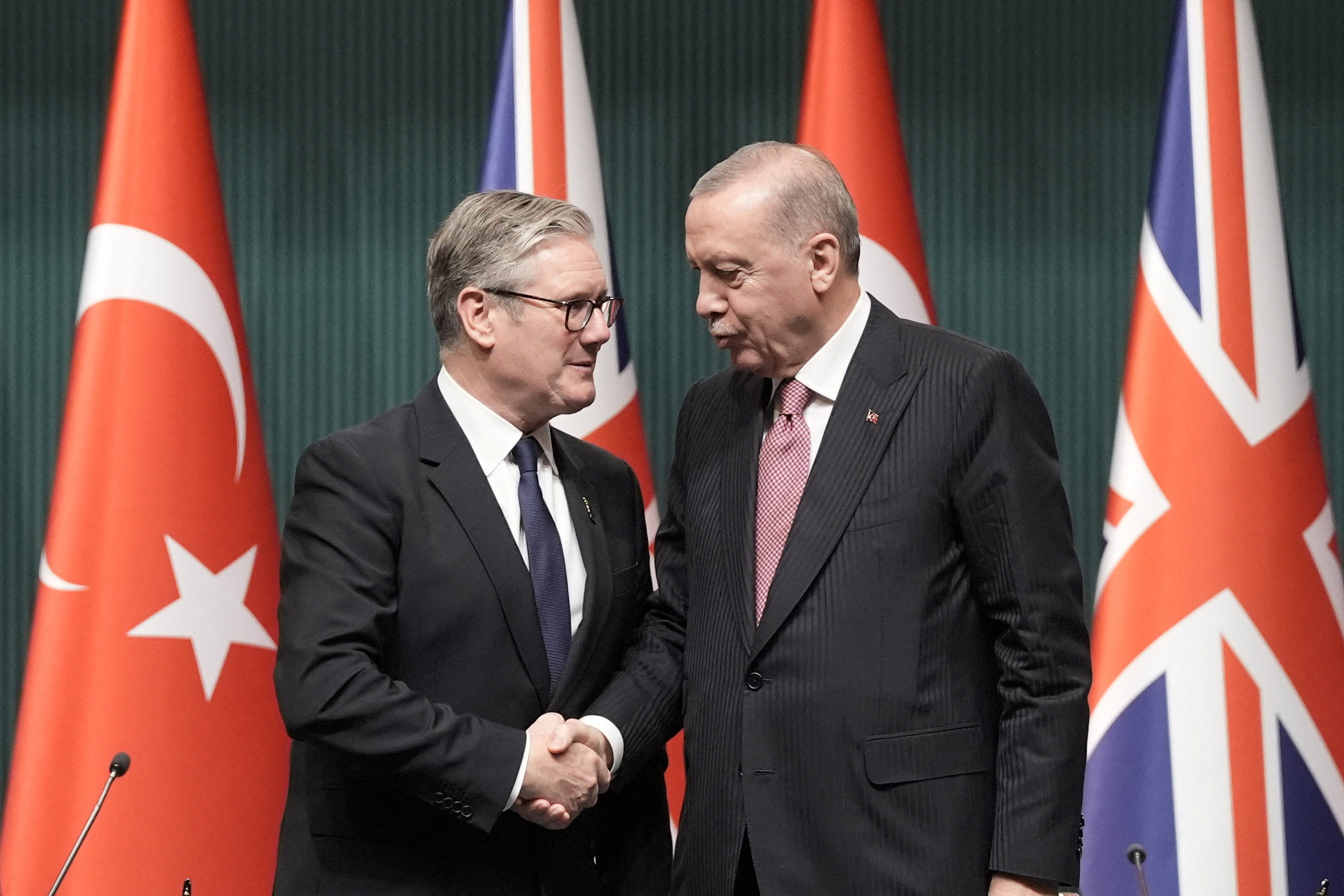 British Prime Minister Keir Starmer and Turkish President Tayyip Erdogan shake hands on the day of signing a deal worth up to £8 billion for 20 UK Typhoon fighter jets, at the Presidential Palace in Ankara, during a visit to Turkey. Picture date: Monday October 27, 2025. Stefan Rousseau/Pool via REUTERS