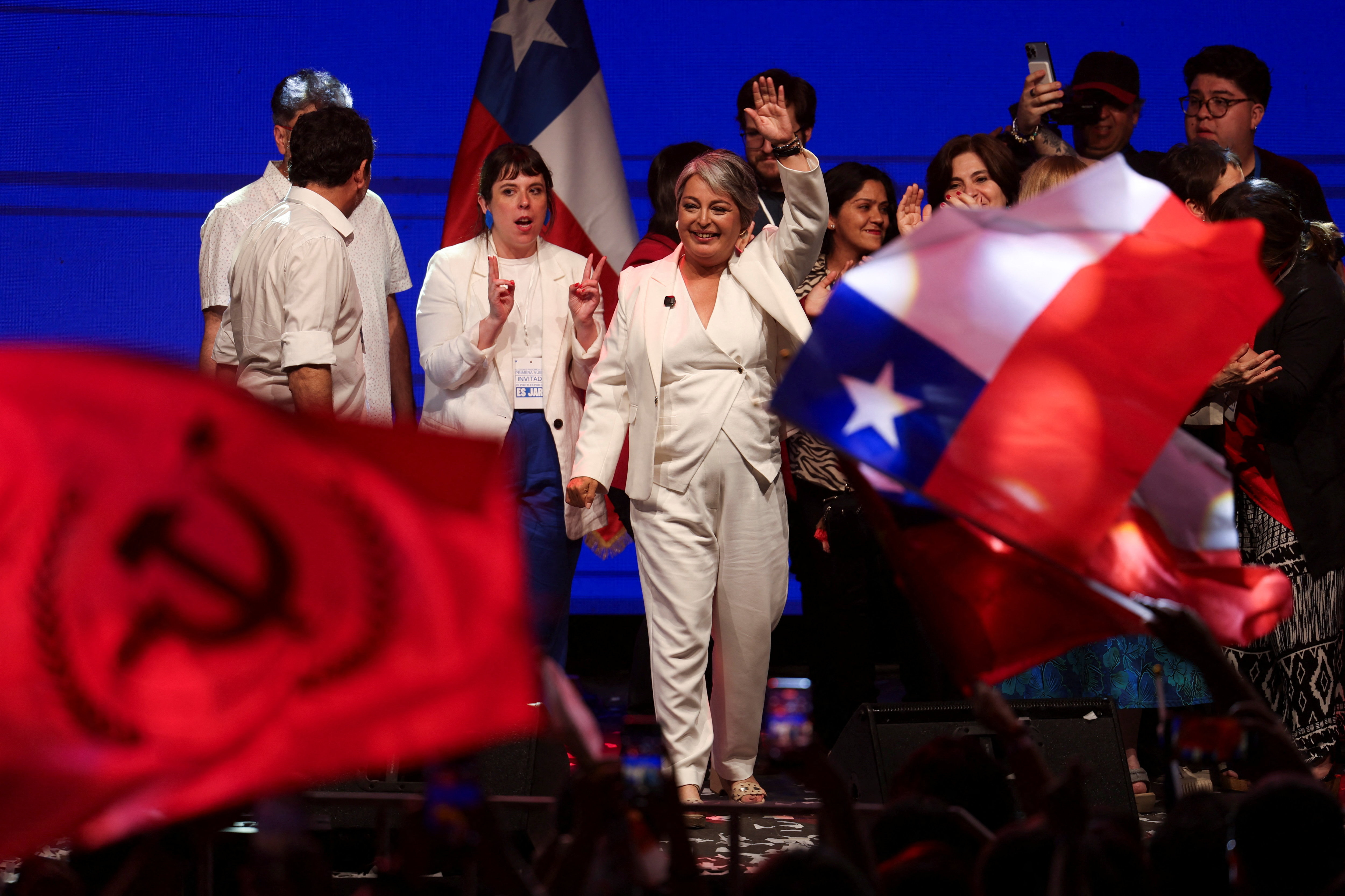 Jeannette Jara, presidential candidate of the ruling leftist-coalition and member of the Communist Party, waves to supporters following early results in the presidential election, in Santiago, Chile November 16, 2025.