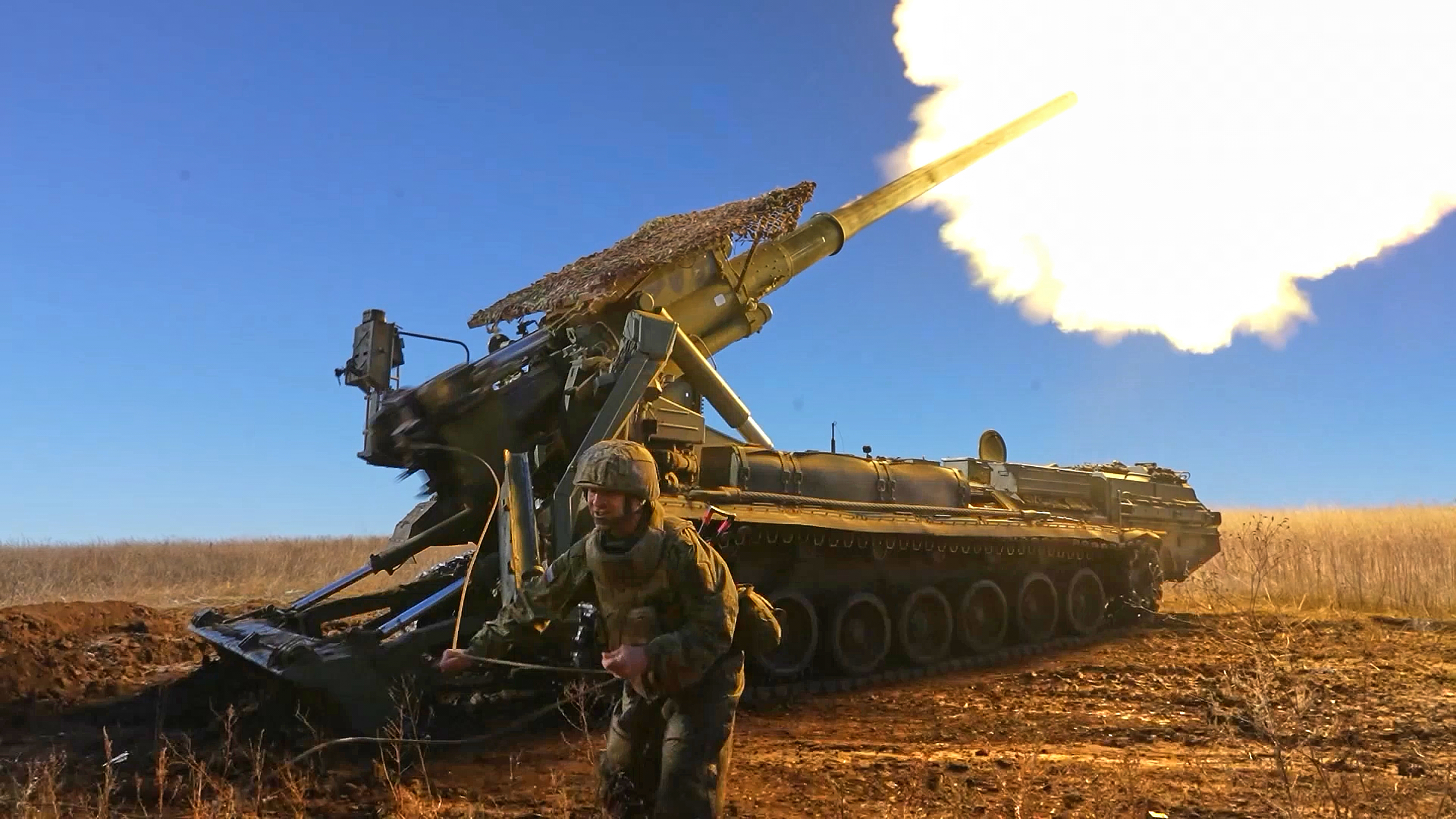 In this image, made from video and provided by Russian Defense Ministry Press Service on Thursday, Nov. 6, 2025, a Russian soldier fires a Malka self-propelled gun towards Ukrainian positions on an undisclosed location in Ukraine. (Russian Defense Ministry Press Service via AP)