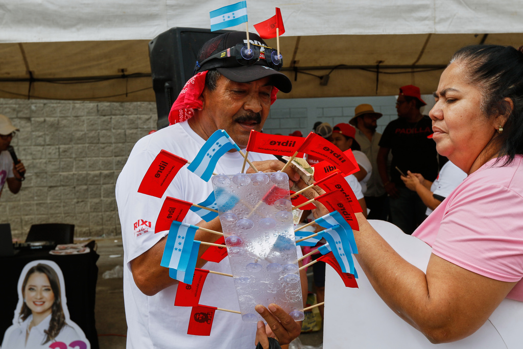 A man sells flags at a political event