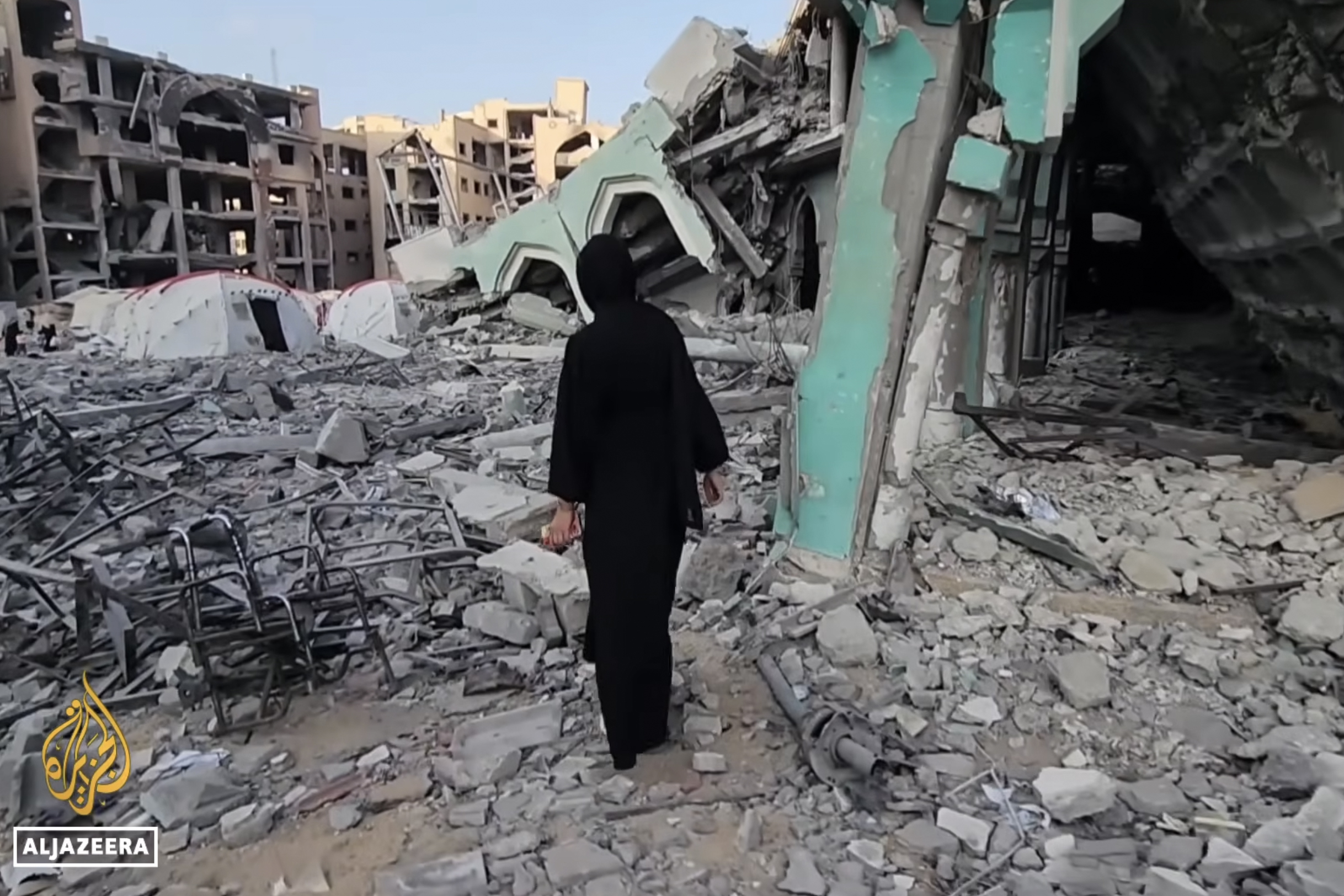 Palestinian medical student Eman Eyad inspects the damage at Gaza's Al-Shifa Hospital, where she has been working.
