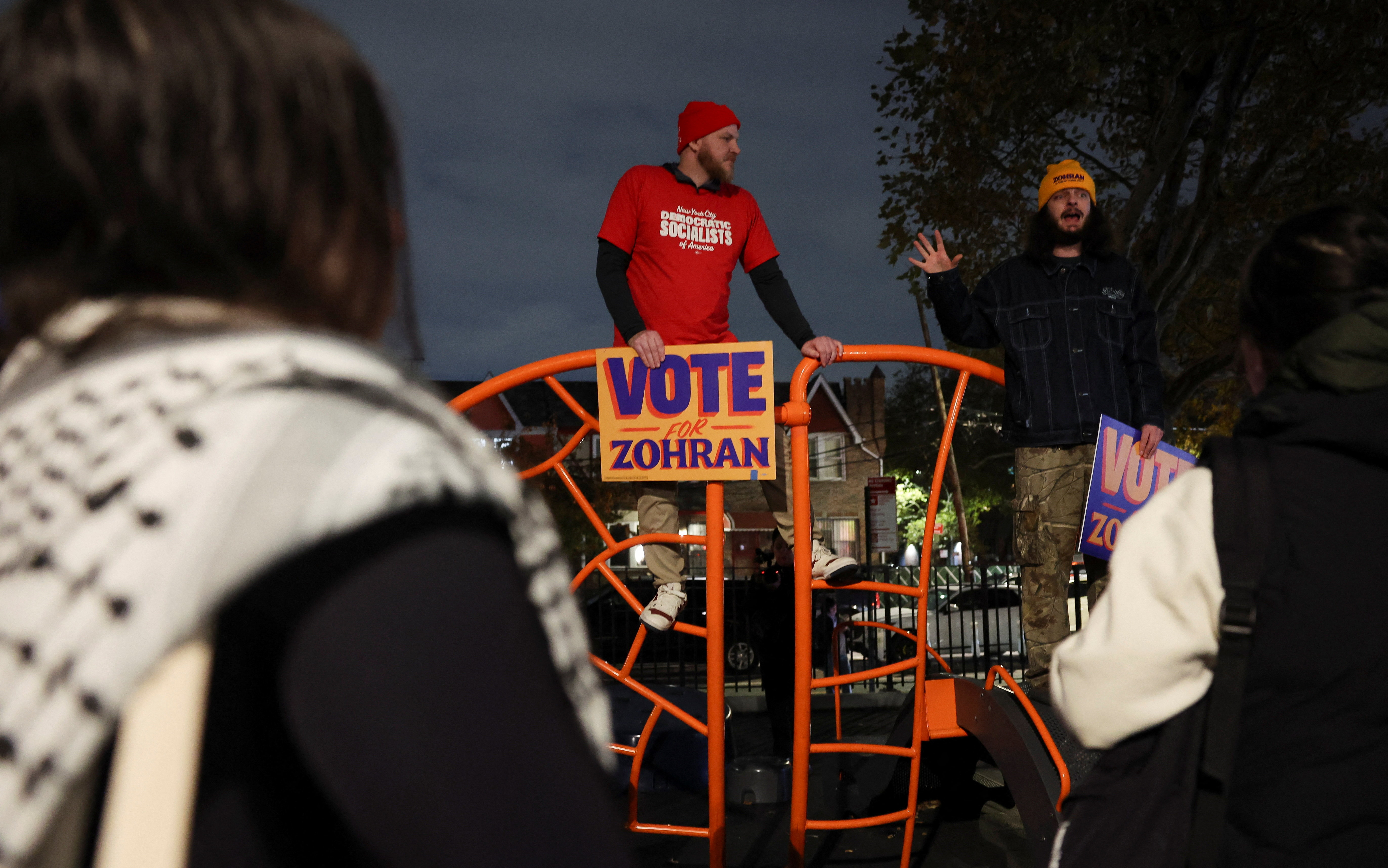 Attendees hold signs that read "vote for Zohran" at a campaign rally held by Democratic candidate for New York City mayor, Zohran Mamdani, on the eve of election day, in the Queens borough of New York City, U.S., November 3, 2025. REUTERS/Shannon Stapleton