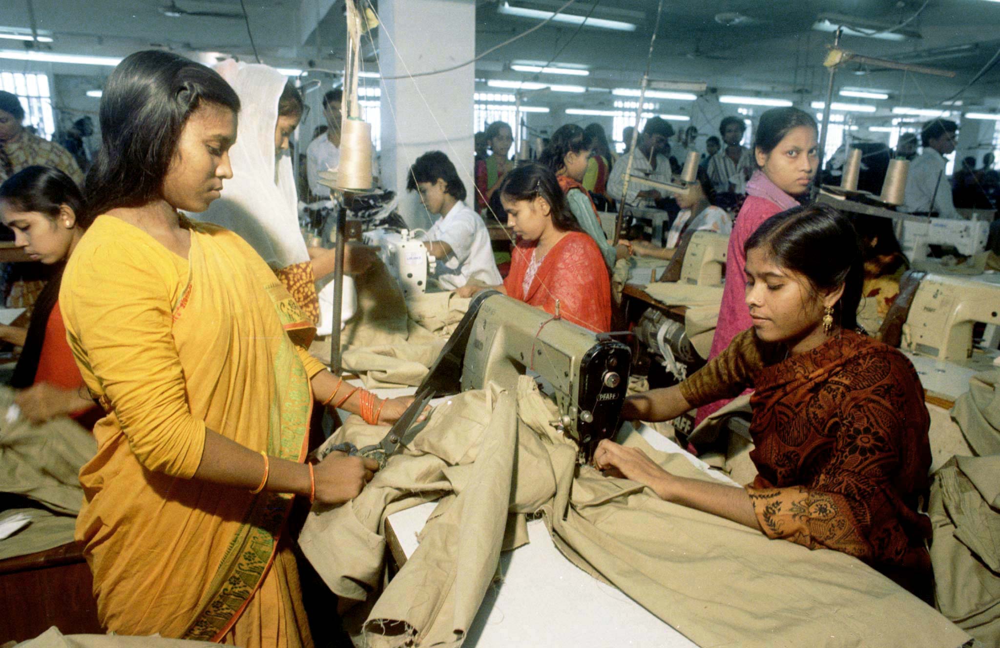 Workers produce export quality garments at a Bangladesh factory in Dhaka October 6. Textile products fetch the impoverished south Asian country some U.S.$3 billion in annual exports, thus becoming the highest foreign exchange earner.