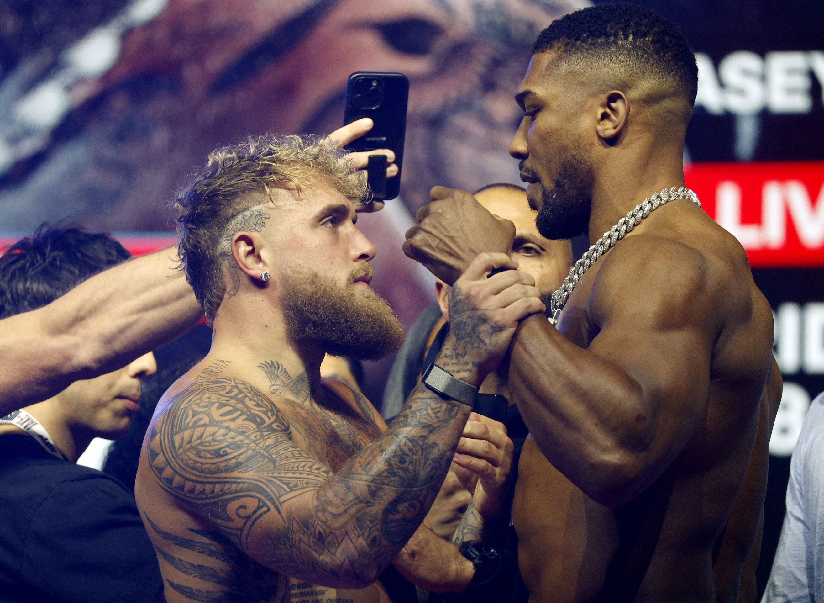 Jake Paul and Anthony Joshua react.
