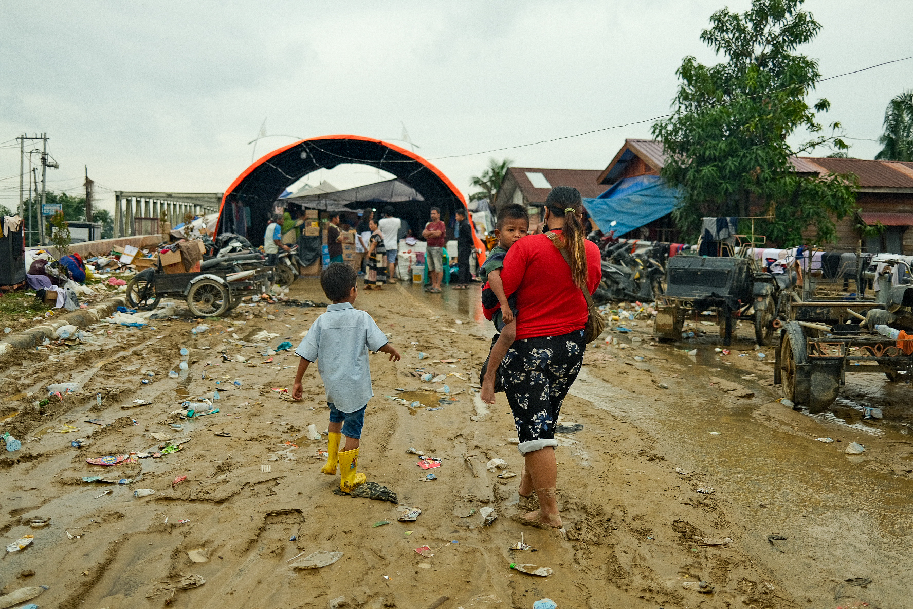 With no schools operating in Aceh Tamiang, children have nothing to do but wait around at shelters.