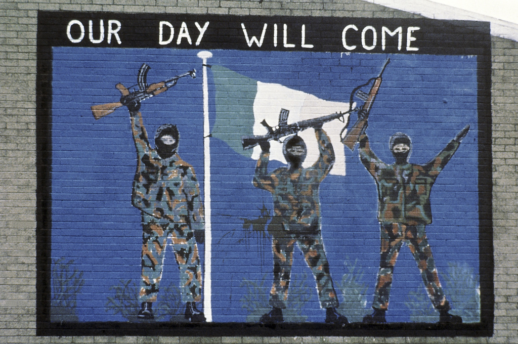 A wall painting supporting the Irish Republican Army, seen in the Catholic area of Belfast, Northern Ireland in November, 1985 [File: Peter Kemp/AP Photo]