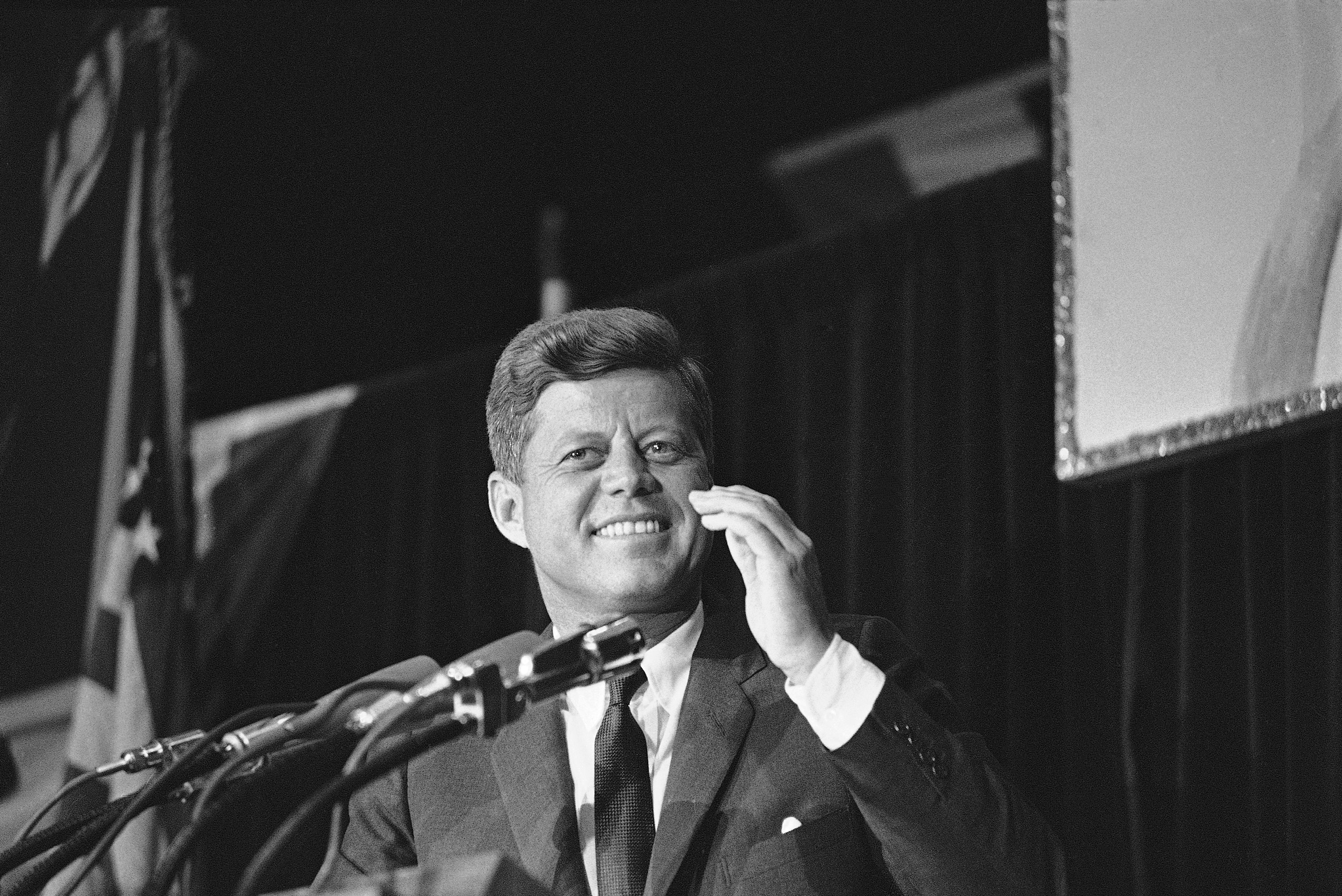 A smile lights the face of President John F. Kennedy as he is cheered during his speech to a big Democratic Party rally in Milwaukee, May 12, 1962, a $100 a plate Jefferson-Jackson Day dinner. The president told the crowd that we cannot permit this country to stand still. (AP Photo)