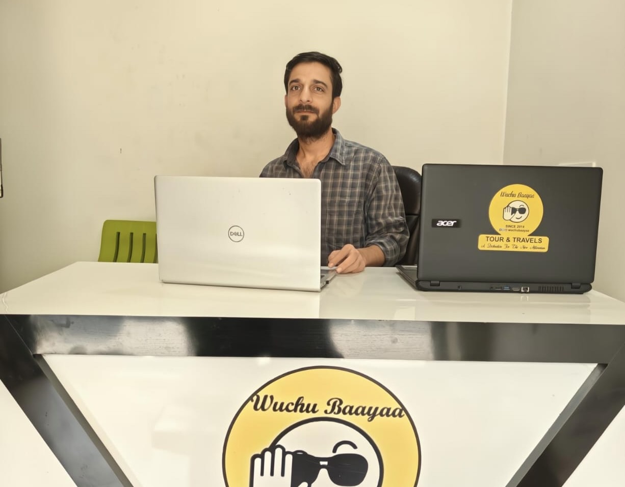 Sajad Ismail Sofi, a Srinagar based travel agent at his office.