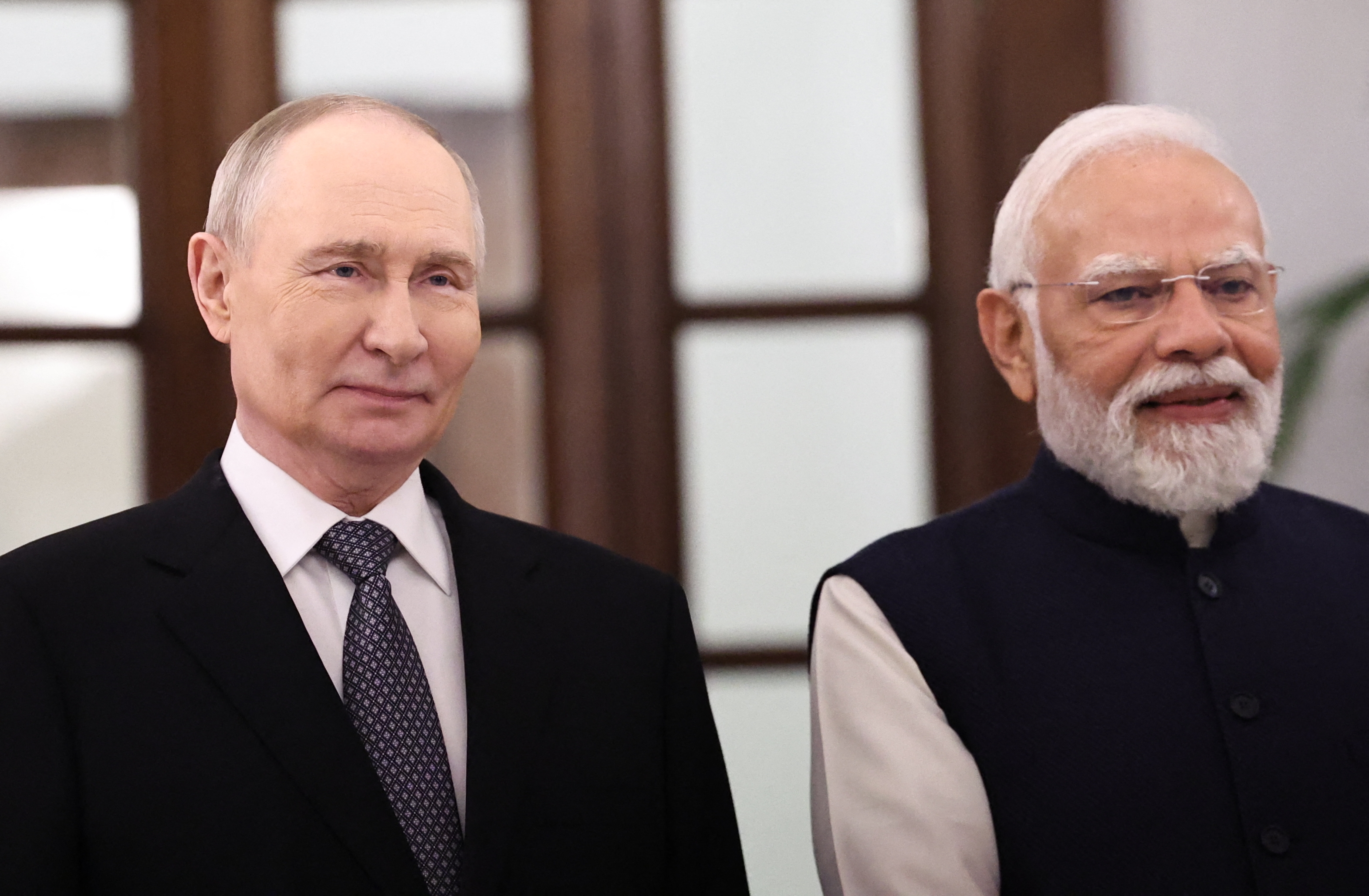 In this pool photograph distributed by the Russian state agency Sputnik, Russia's President Vladimir Putin and India's Prime Minister Narendra Modi are seen after their talks at the Hyderabad House in New Delhi on December 5, 2025.