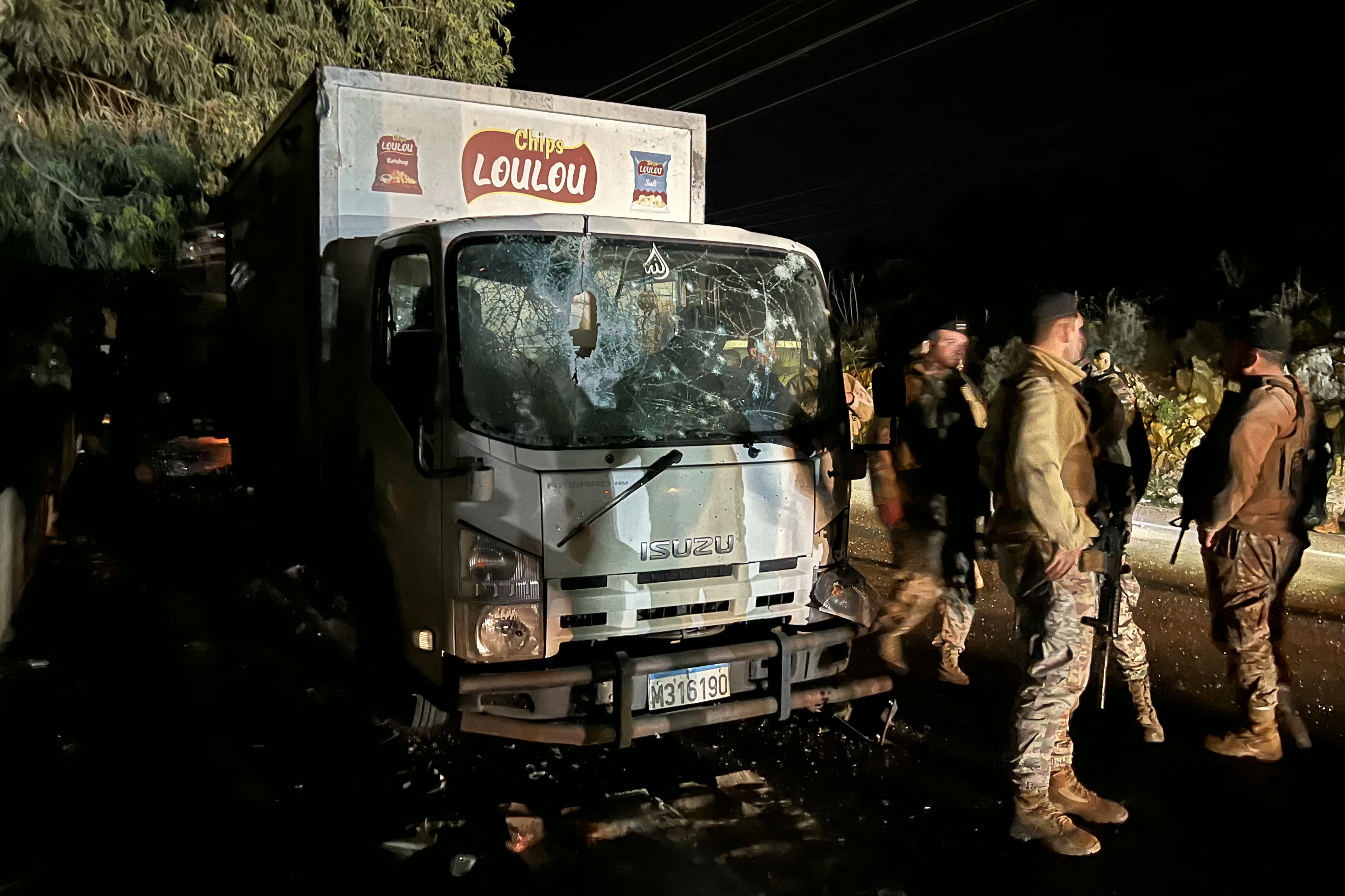 CORRECTION / Lebanese soldiers secure the site of an Israeli drone strike that targeted a truck in the village of Sibline, south of Beirut, on December 16, 2025.
