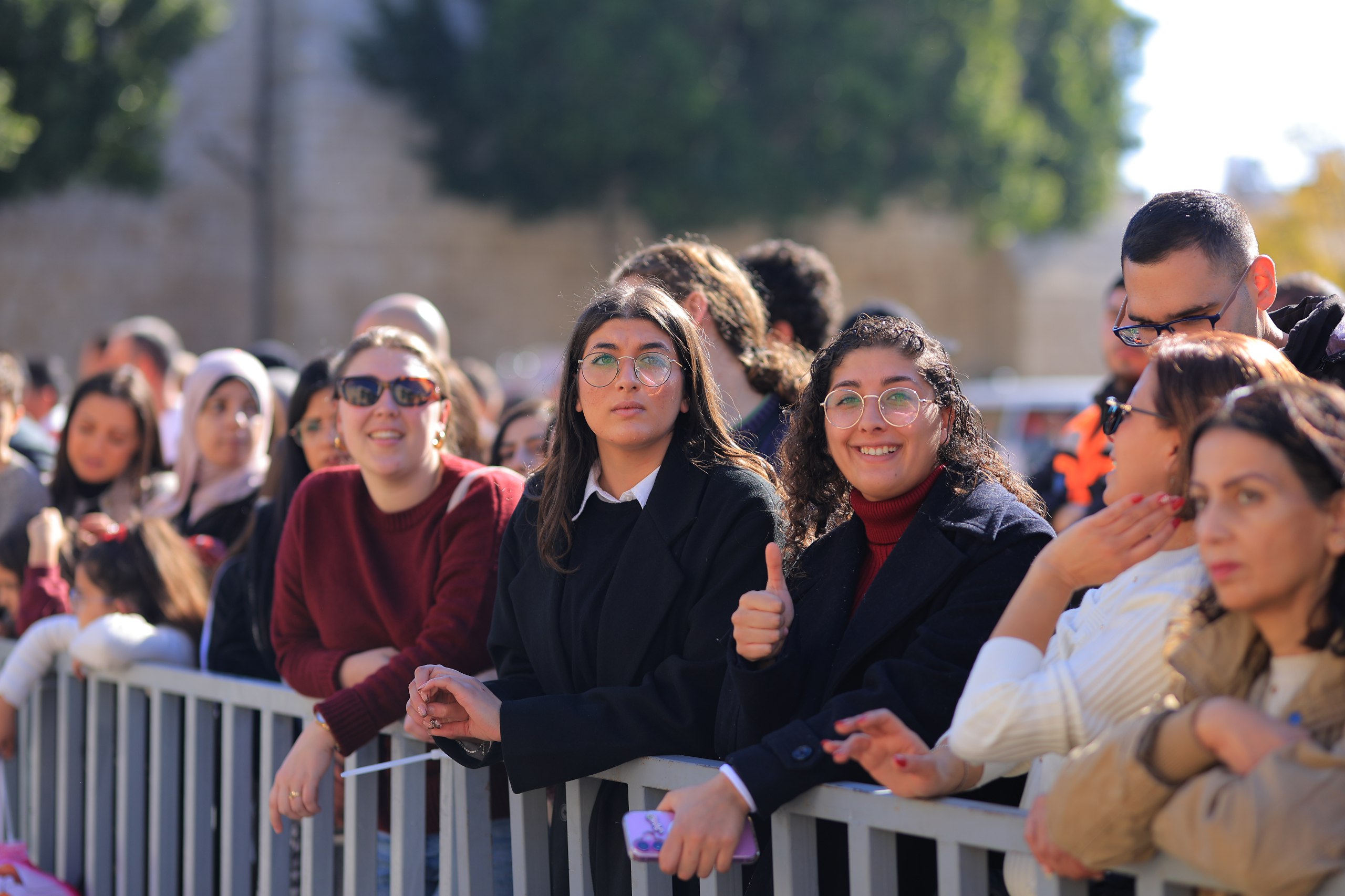 Women gathered at a barrier