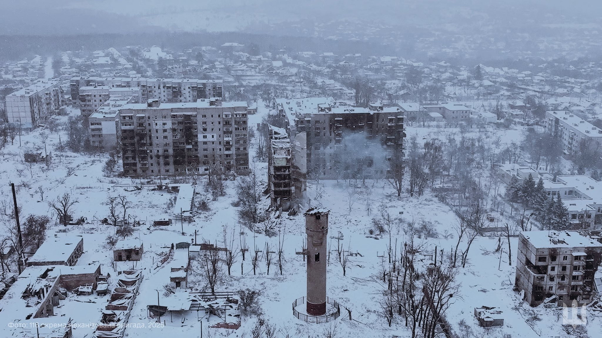 A drone view shows damaged apartment buildings, amid Russia's attack on Ukraine, in the frontline town of Kupiansk, Kharkiv region, Ukraine in this handout picture released December 30, 2025. Press service of the 116th Separate Mechanized Brigade of the Ukrainian Armed Forces/Handout via REUTERS ATTENTION EDITORS - THIS IMAGE HAS BEEN SUPPLIED BY A THIRD PARTY. MUST NOT OBSCURE LOGO. TEXT OVERLAY FROM SOURCE.