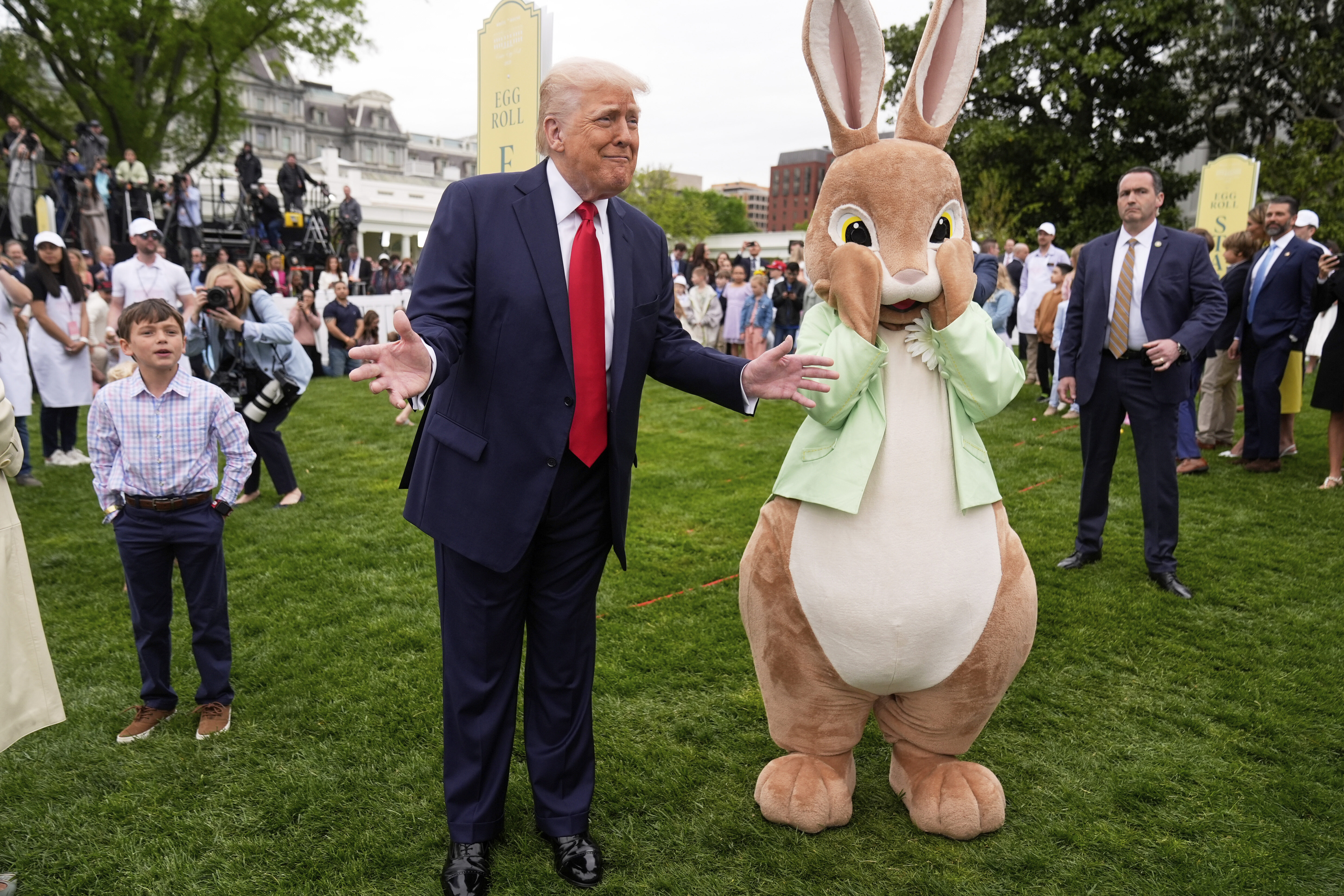 Donald Trump stands next to the Easter Bunny