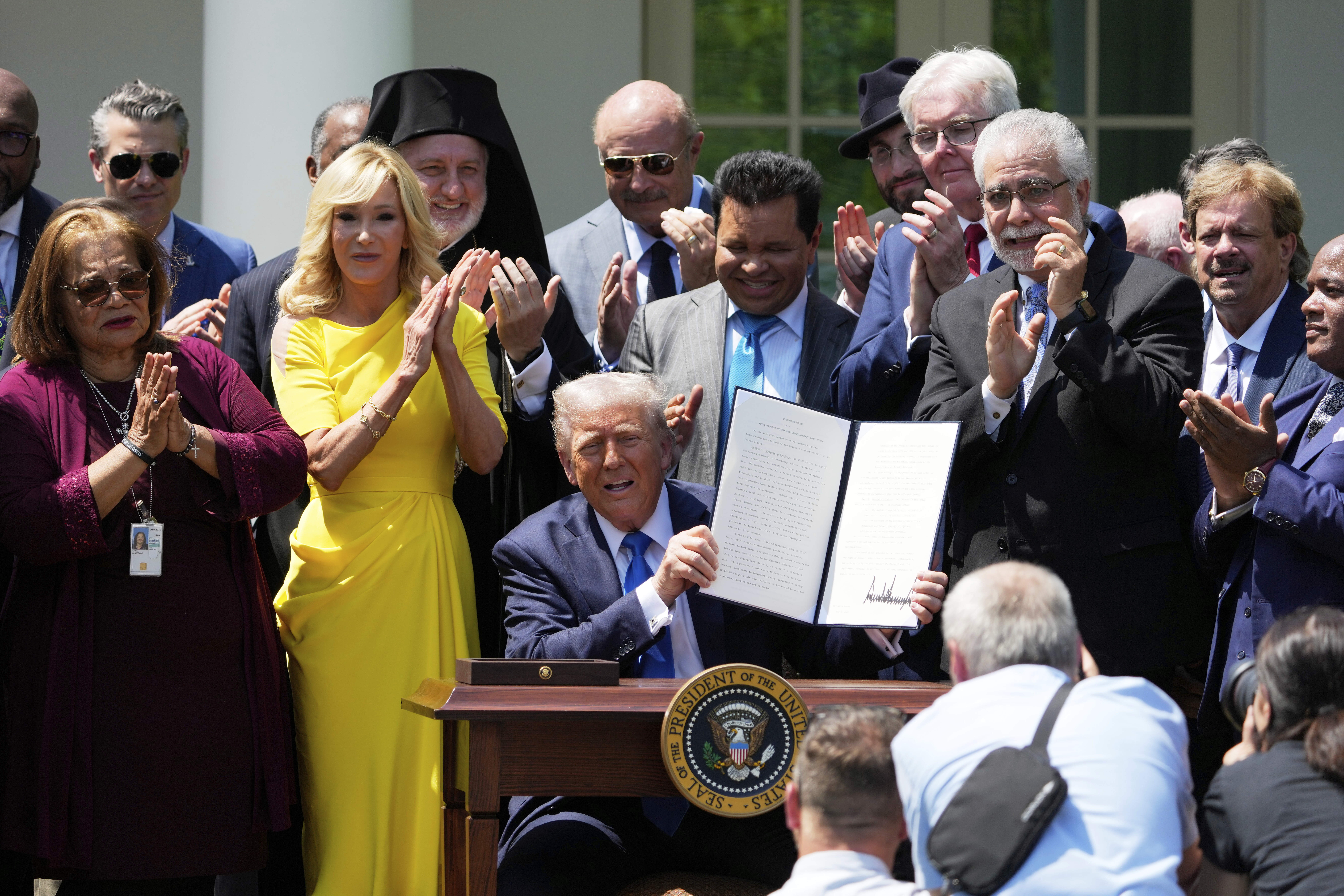 Trump signs an executive order in the Rose Garden