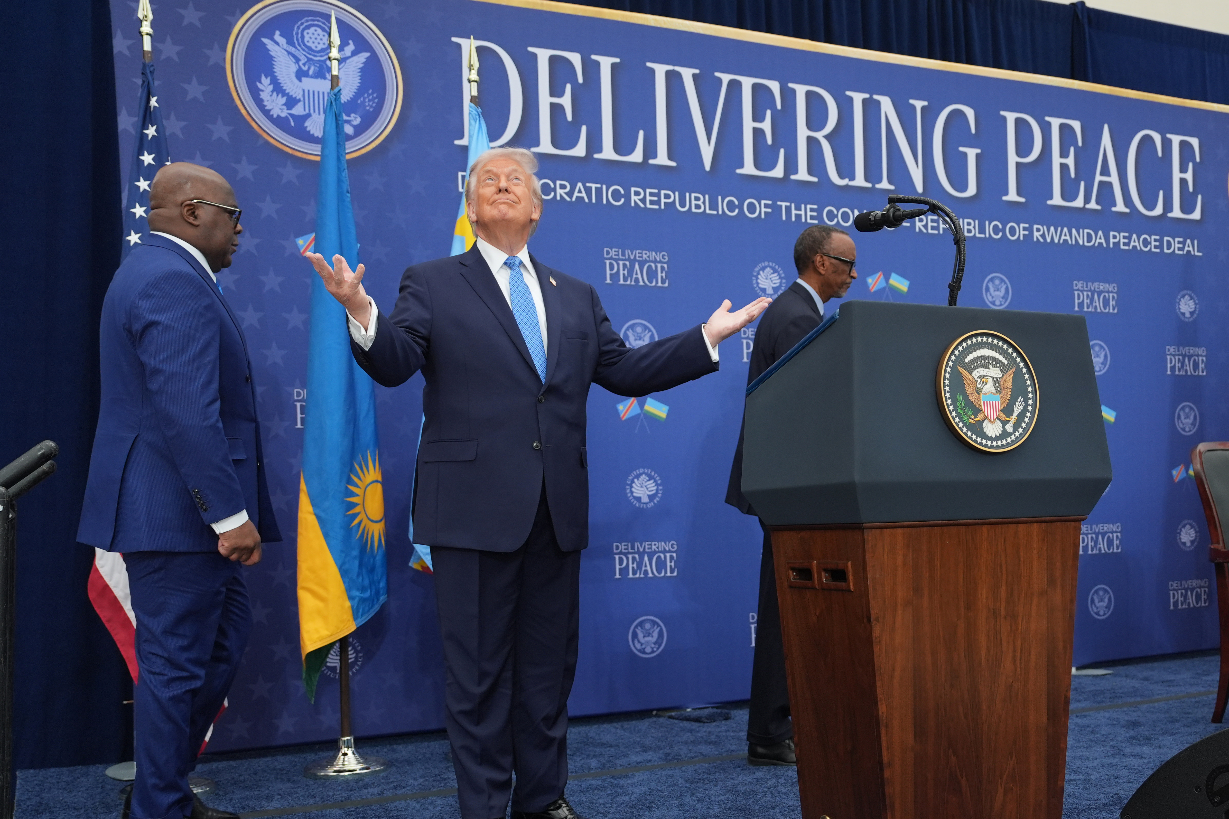 Trump holds a news conference under the banner, "Delivering Peace"