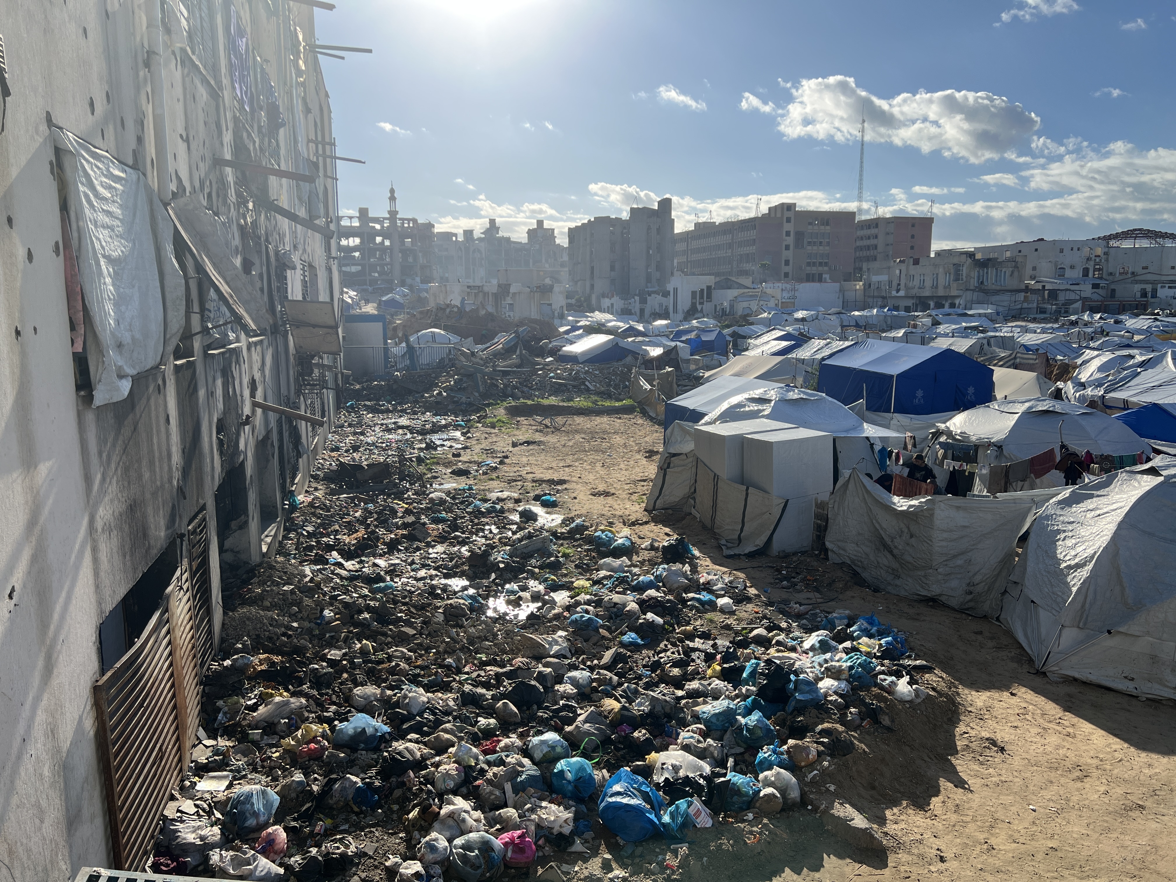 Garbage dump near the makeshift tents of displaced Palestinians in Gaza City