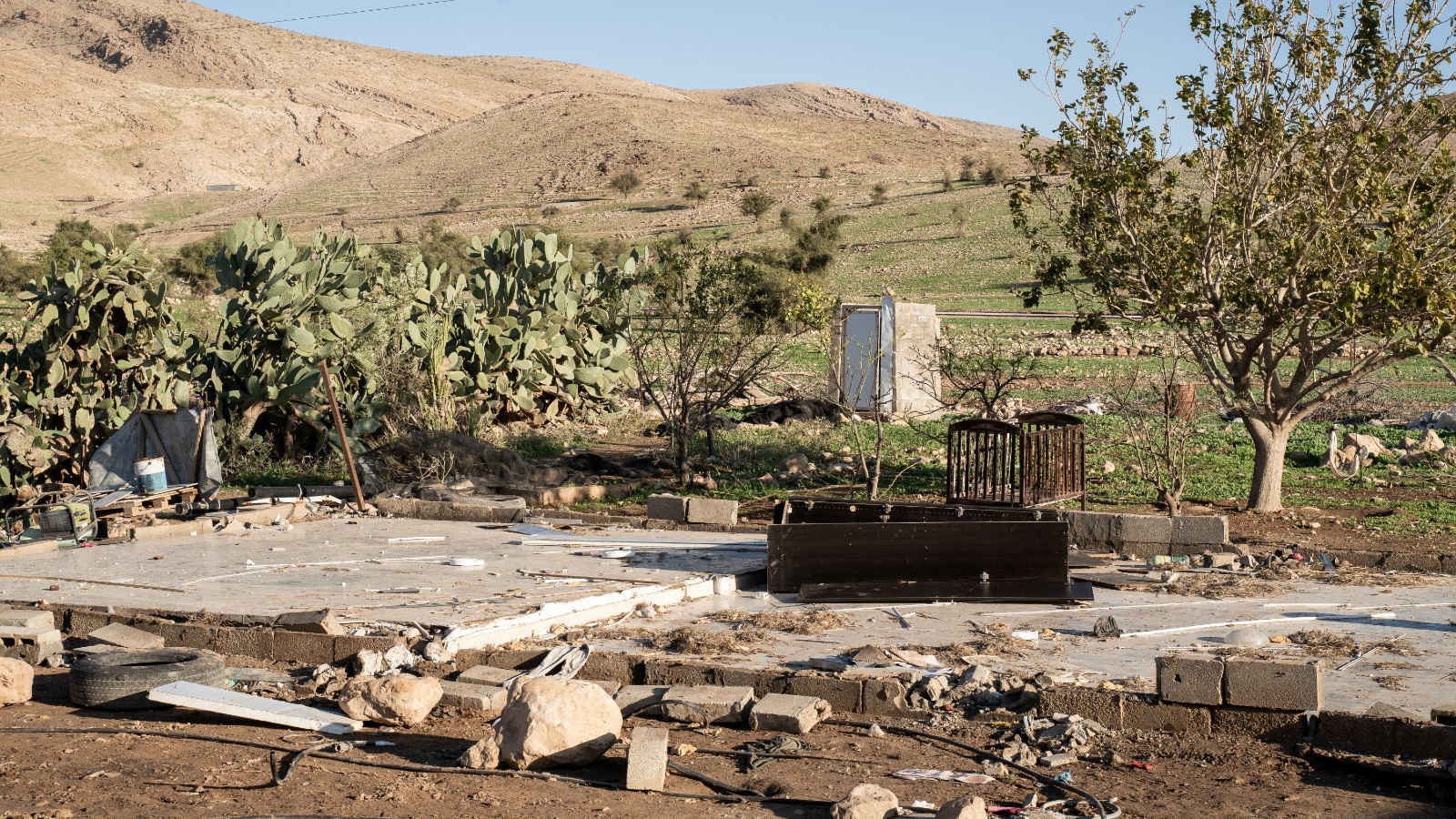 A Palestinian home is entirely dismantled, except for the floor, in the occupied West Bank village of Ras Ein al-Auja, nearly all of whose residents have been forced out by pogroms enacted by Israelis from illegal settlements [Courtesy of Looking the Occupation in the Eye]