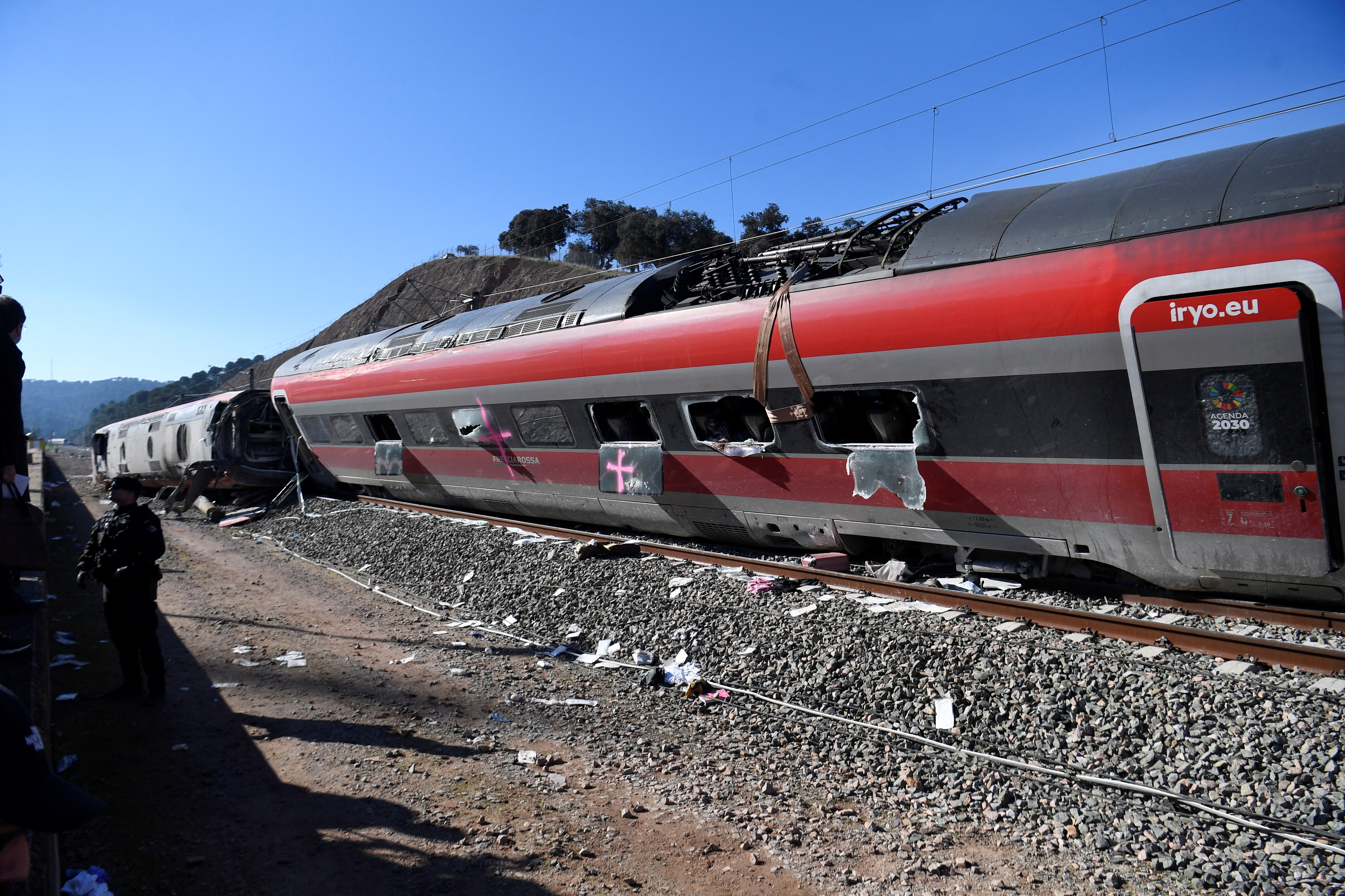 TOPSHOT - A picture taken on January 20, 2026 shows a view of a high-speed Iryo train that derailed and hit another train two days before, in Adamuz, southern Spain.