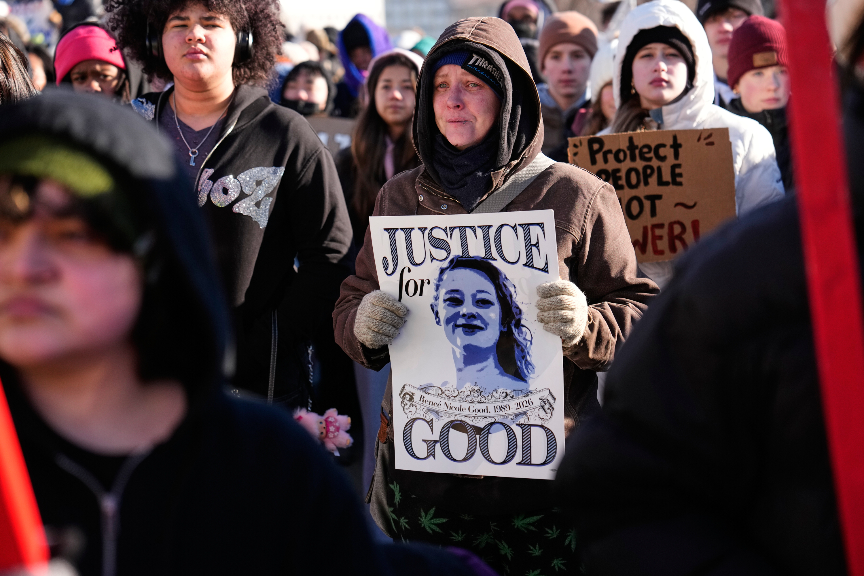 Protesters gather in front of the Minnesota State Capitol in response to the death of Renee Good, who was fatally shot by an ICE officer last week, Wednesday, Jan. 14, 2026, in St. Paul, Minn. (AP Photo/John Locher)