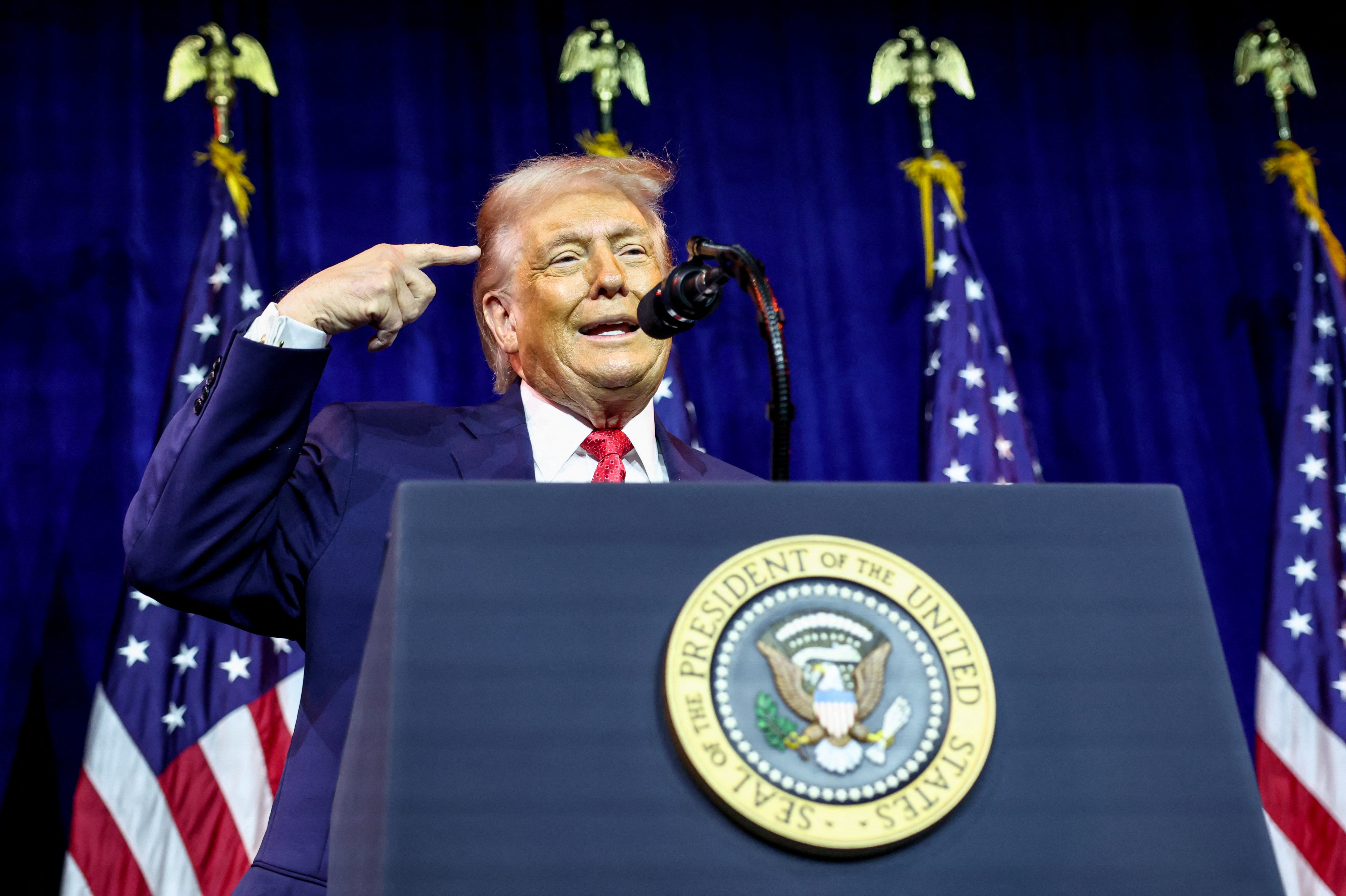 U.S. President Donald Trump addresses House Republicans at their annual issues conference retreat, at the Kennedy Center, renamed the Trump-Kennedy Center by the Trump-appointed board of directors, in Washington, D.C., U.S., January 6, 2026. REUTERS/Kevin Lamarque