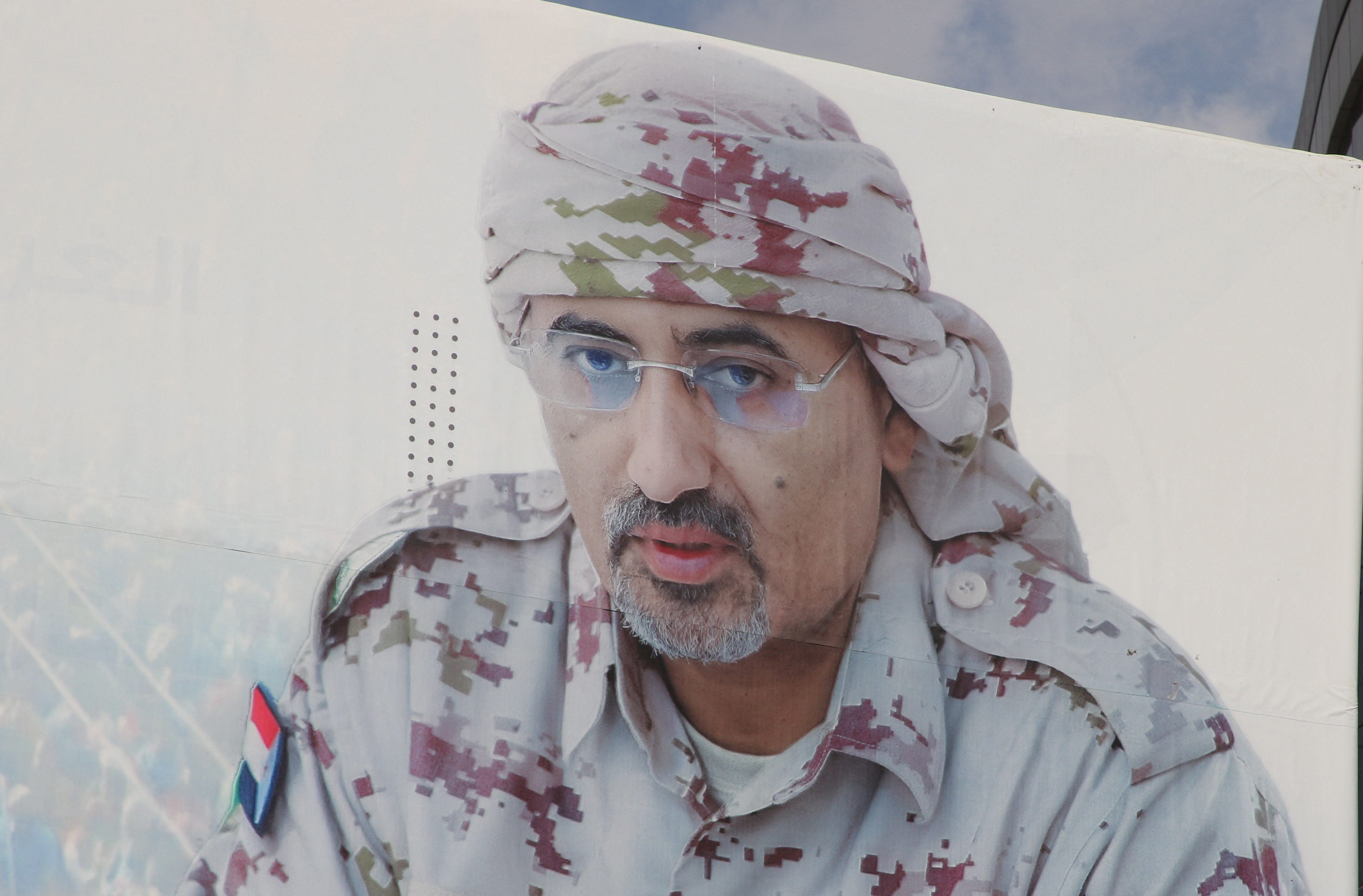 A billboard displays an image of Aidarous al-Zubaidi, the leader of Yemen's Southern Transitional Council (STC), who, according to the Saudi-backed coalition, fled to an unknown destination, in Aden, Yemen January 7, 2026. REUTERS/Fawaz Salman