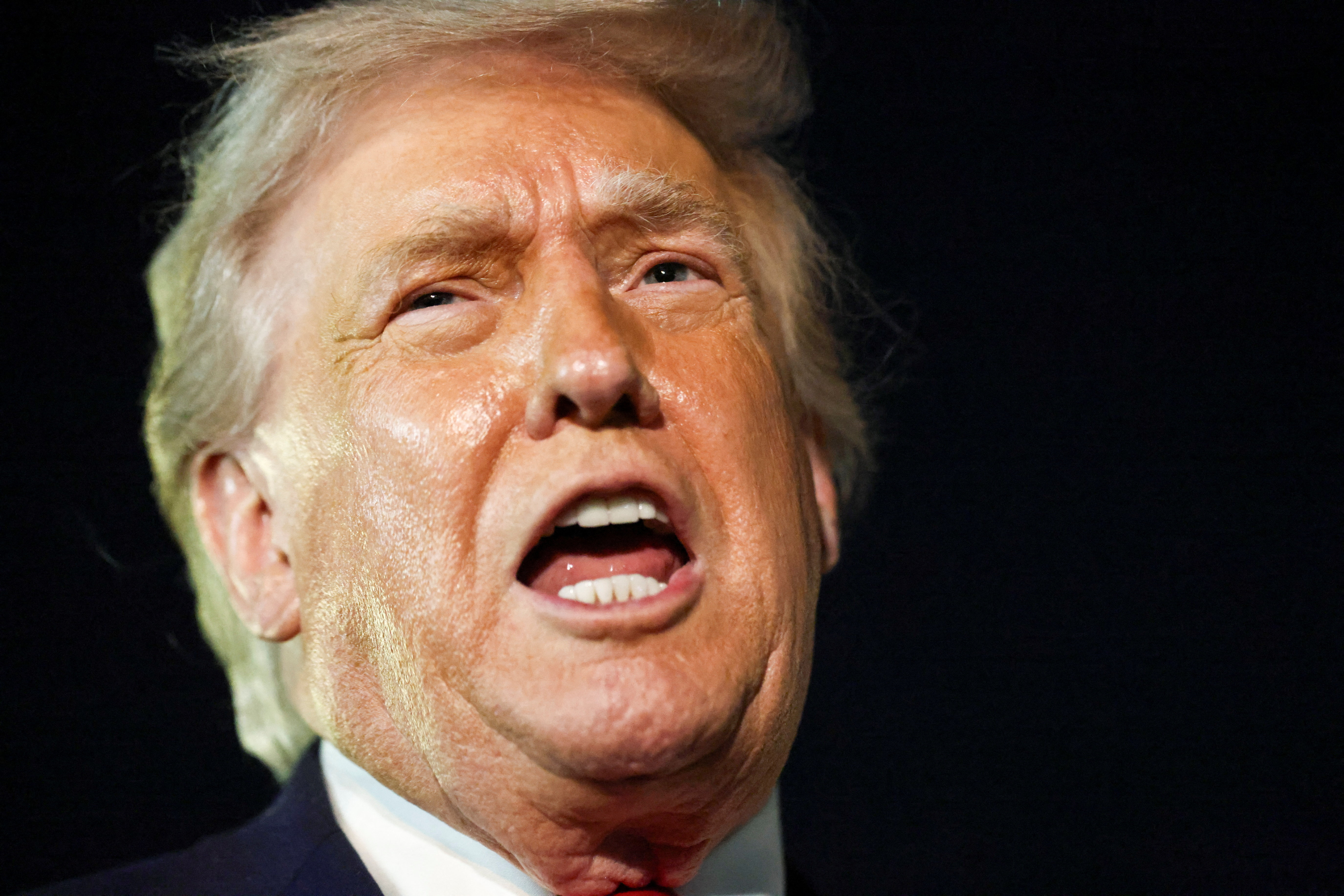 U.S. President Donald Trump speaks to members of the media ahead of boarding Air Force One to depart for Washington, at Palm Beach International Airport in West Palm Beach, Florida, U.S., January 19, 2026. REUTERS/Kevin Lamarque