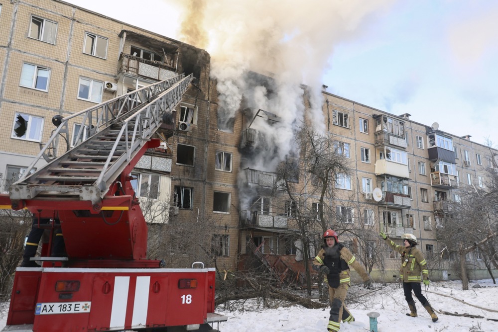 epaselect epa12702871 Ukrainian rescuers work at the site of a drone strike on a residential building in Kharkiv, northeastern Ukraine, 03 February 2026, amid the Russian invasion. At least five people were injured as a result of the attack, Ukraine's National Police said. EPA/SERGEY KOZLOV