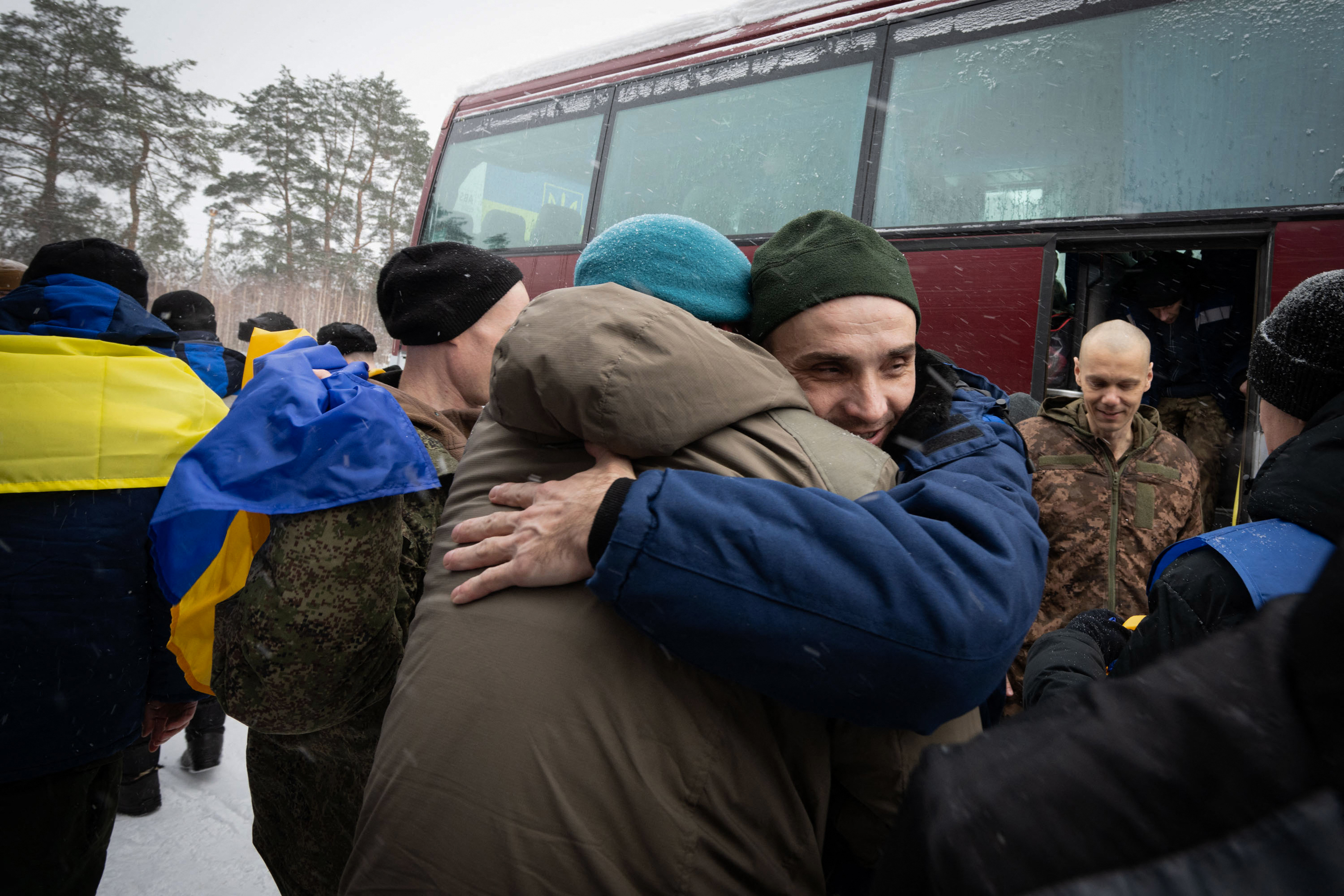 Ukrainian prisoners of war (POW) released from Russian captivity embrace