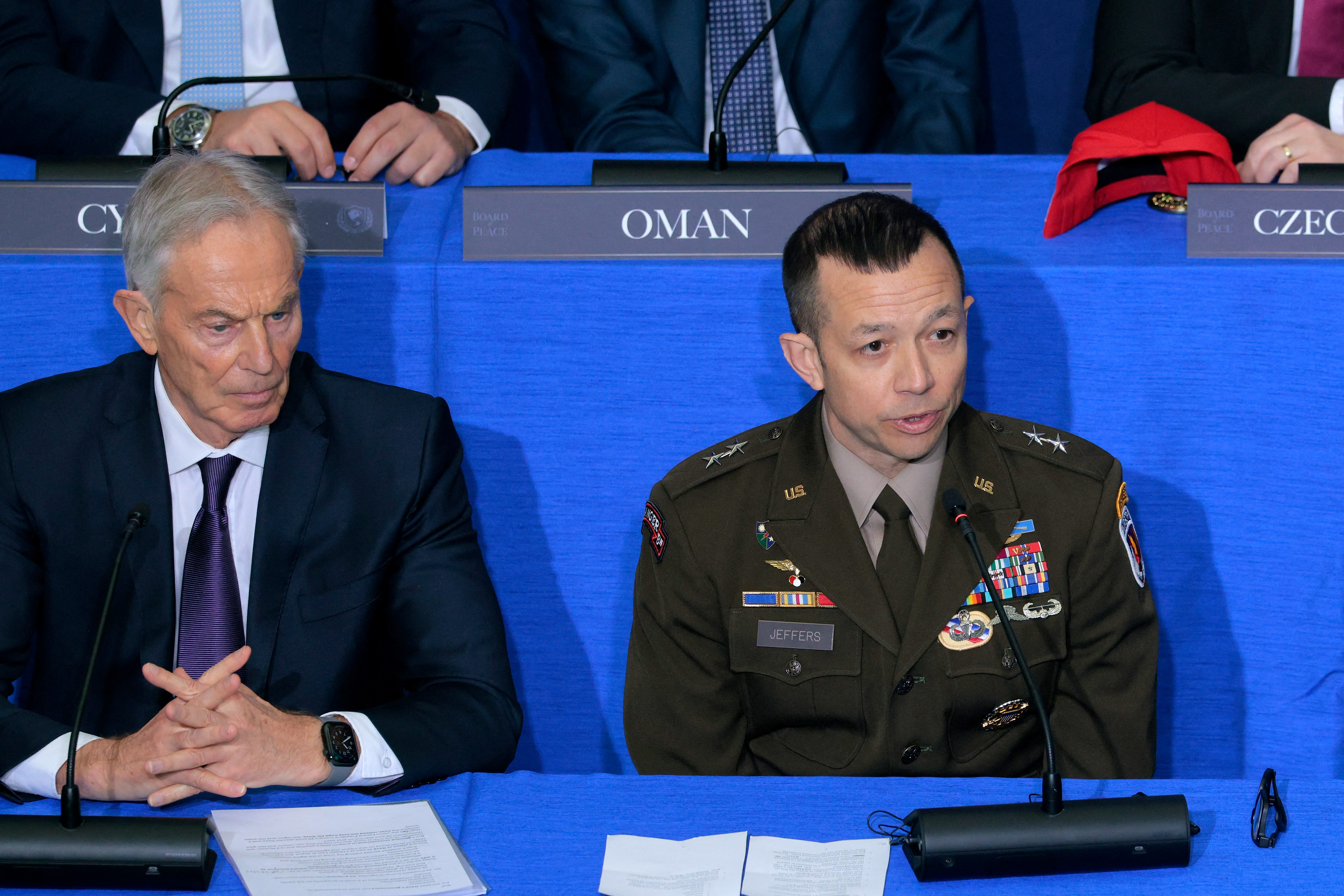 ISF Commander Major-General Jasper Jeffers (R) speaks as former UK Prime Minister Tony Blair listens during inaugural meeting.