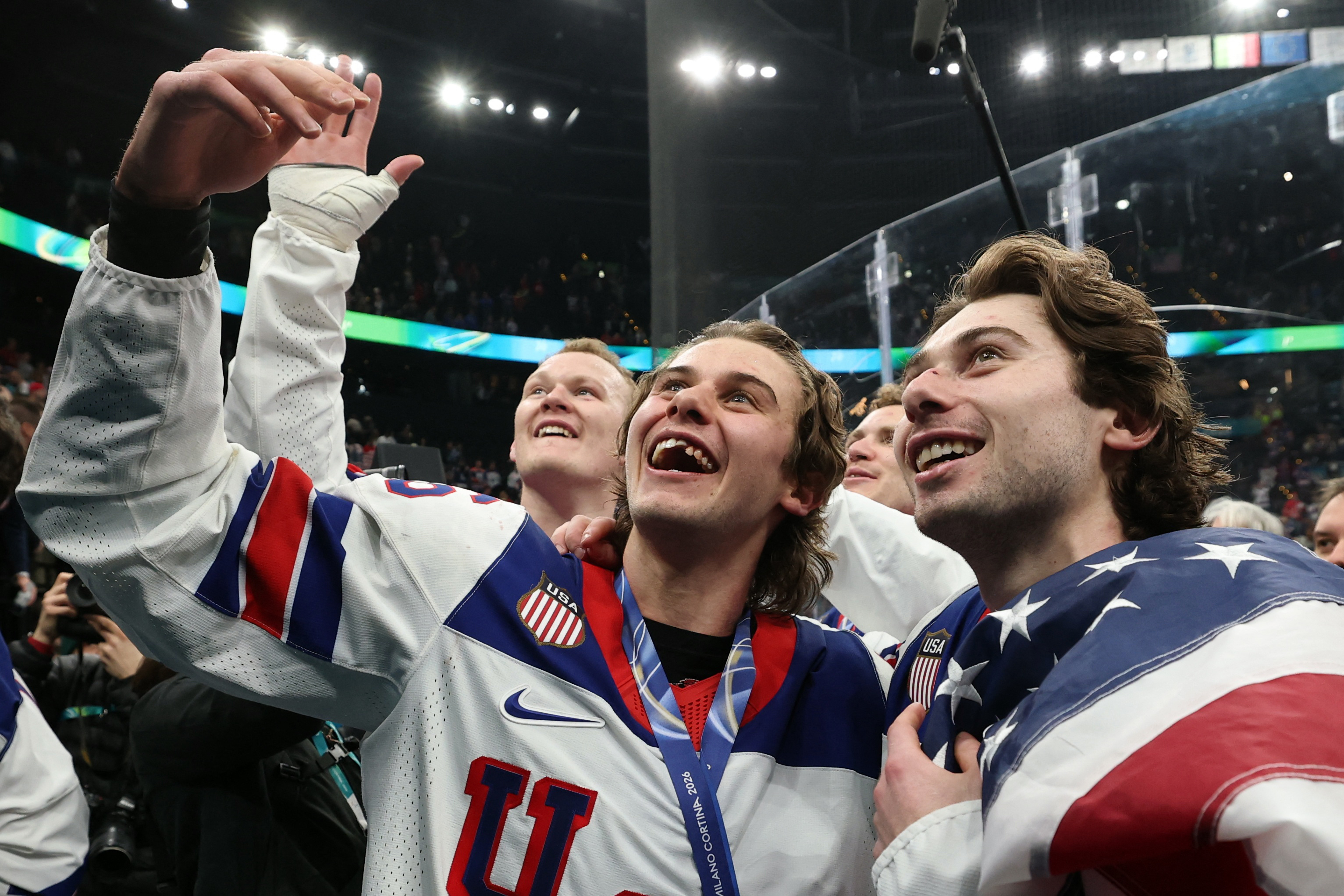 Milano Cortina 2026 Olympics - Ice Hockey - Men's Victory Ceremony - Milano Santagiulia Ice Hockey Arena, Milan, Italy - February 22, 2026. Gold medallists Brady Tkachuk of United States, Jack Hughes of United States and Quinn Hughes of United States celebrate during the victory ceremony REUTERS/Mike Segar