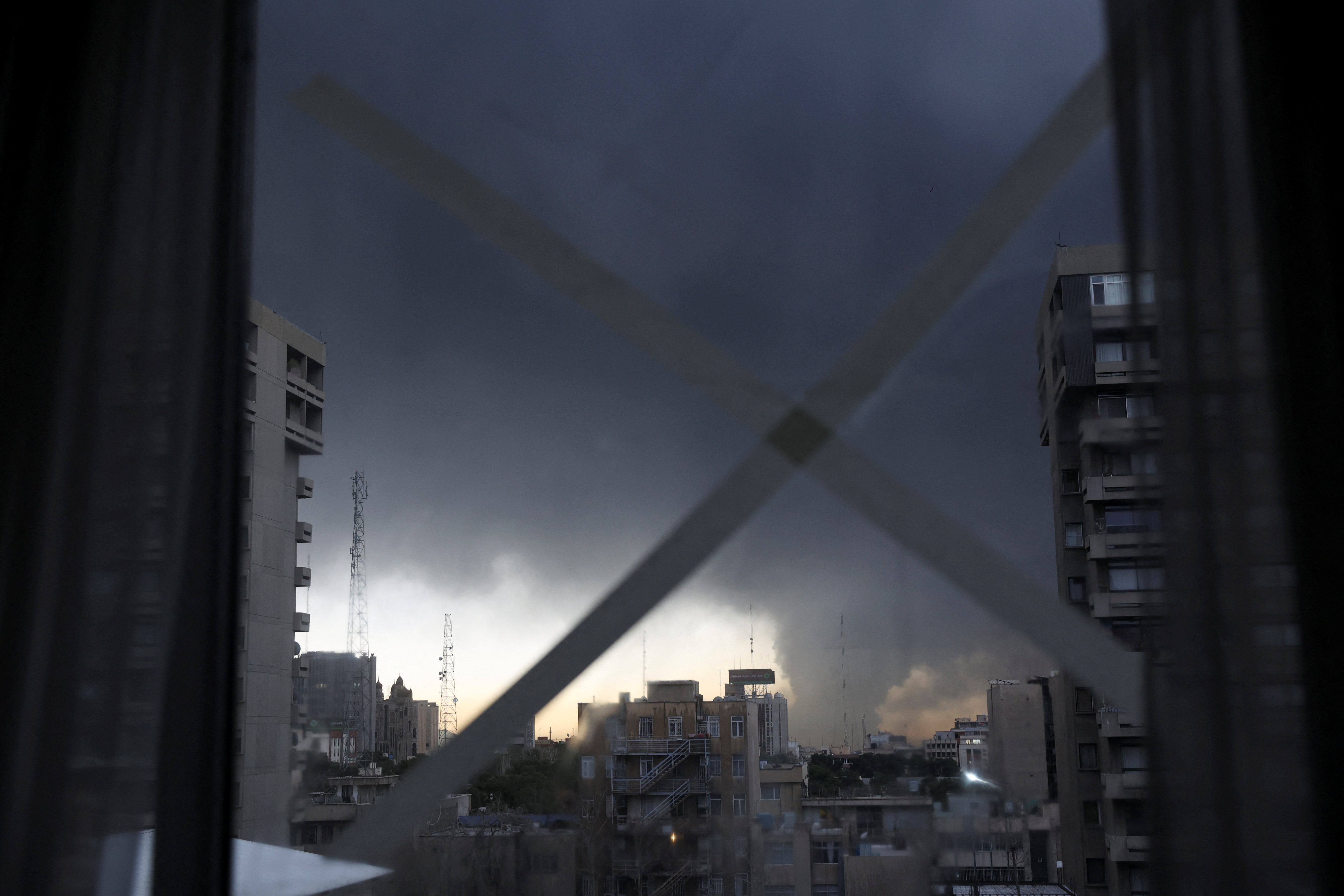 A dark haze hung over the city as Sunday morning broke and a smell of burning lingered in the air.